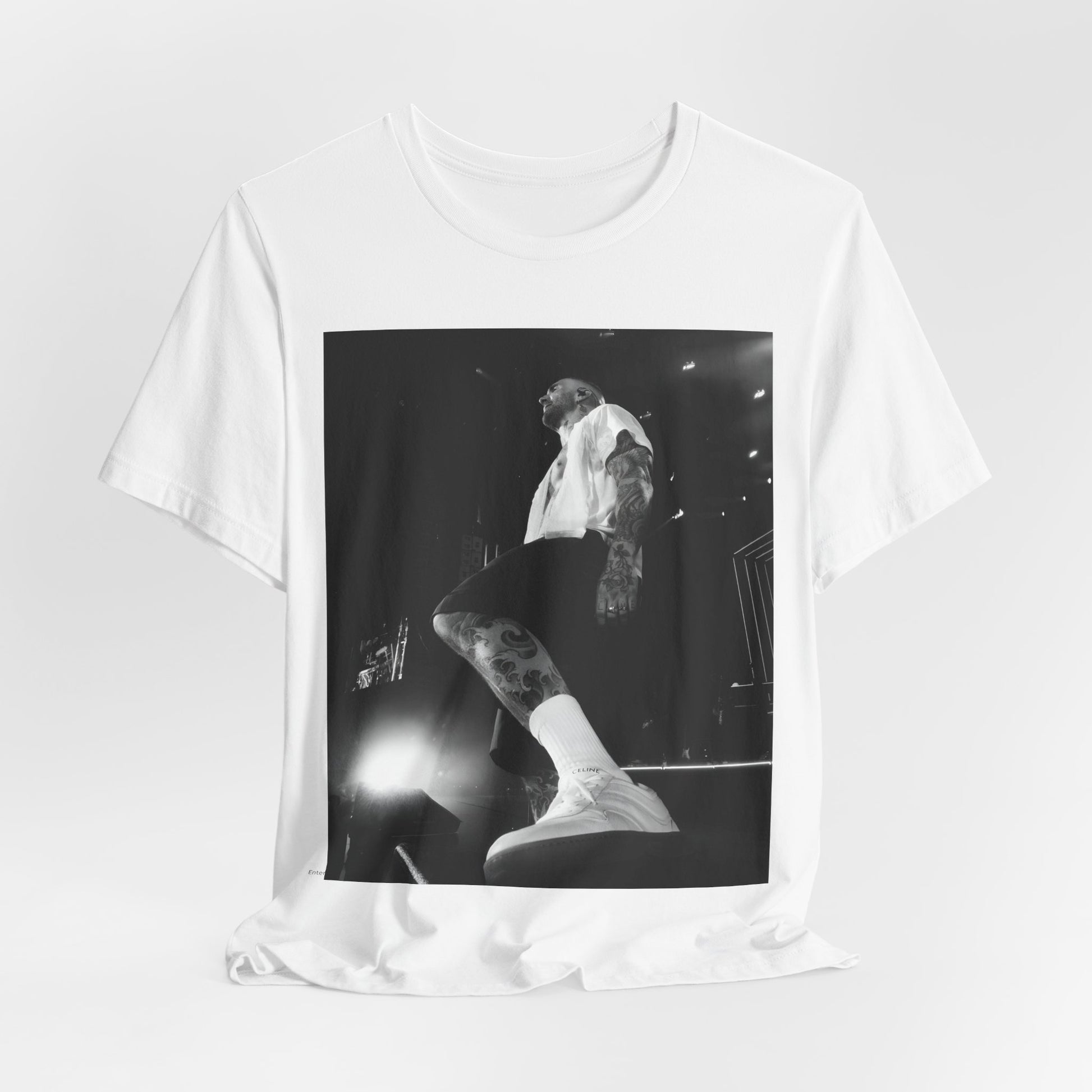 The abstract, geometric 'V' logo from the cover of the Maroon 5 album V, printed on a t-shirt.