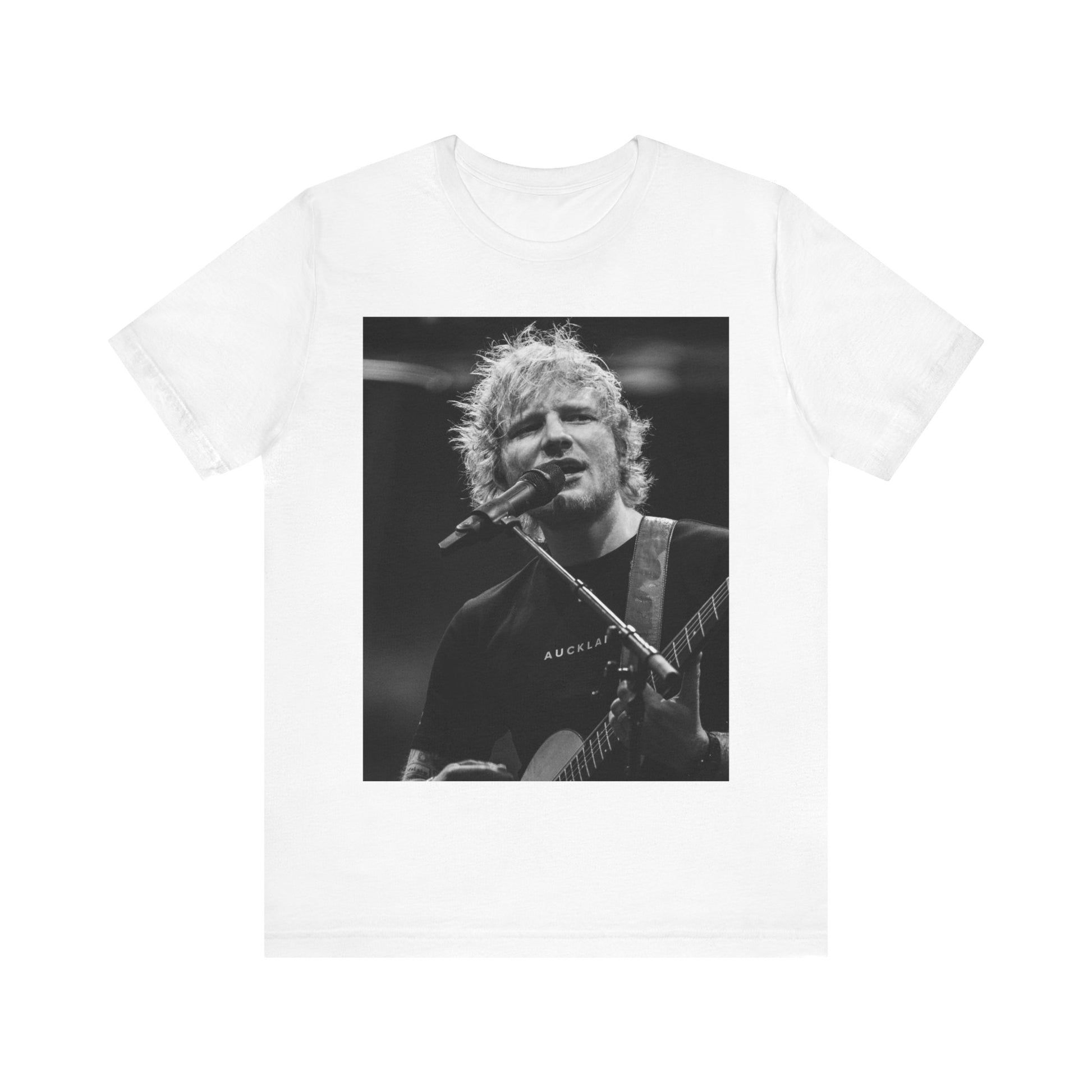 A black graphic t-shirt featuring a black and white photo of Ed Sheeran performing live.