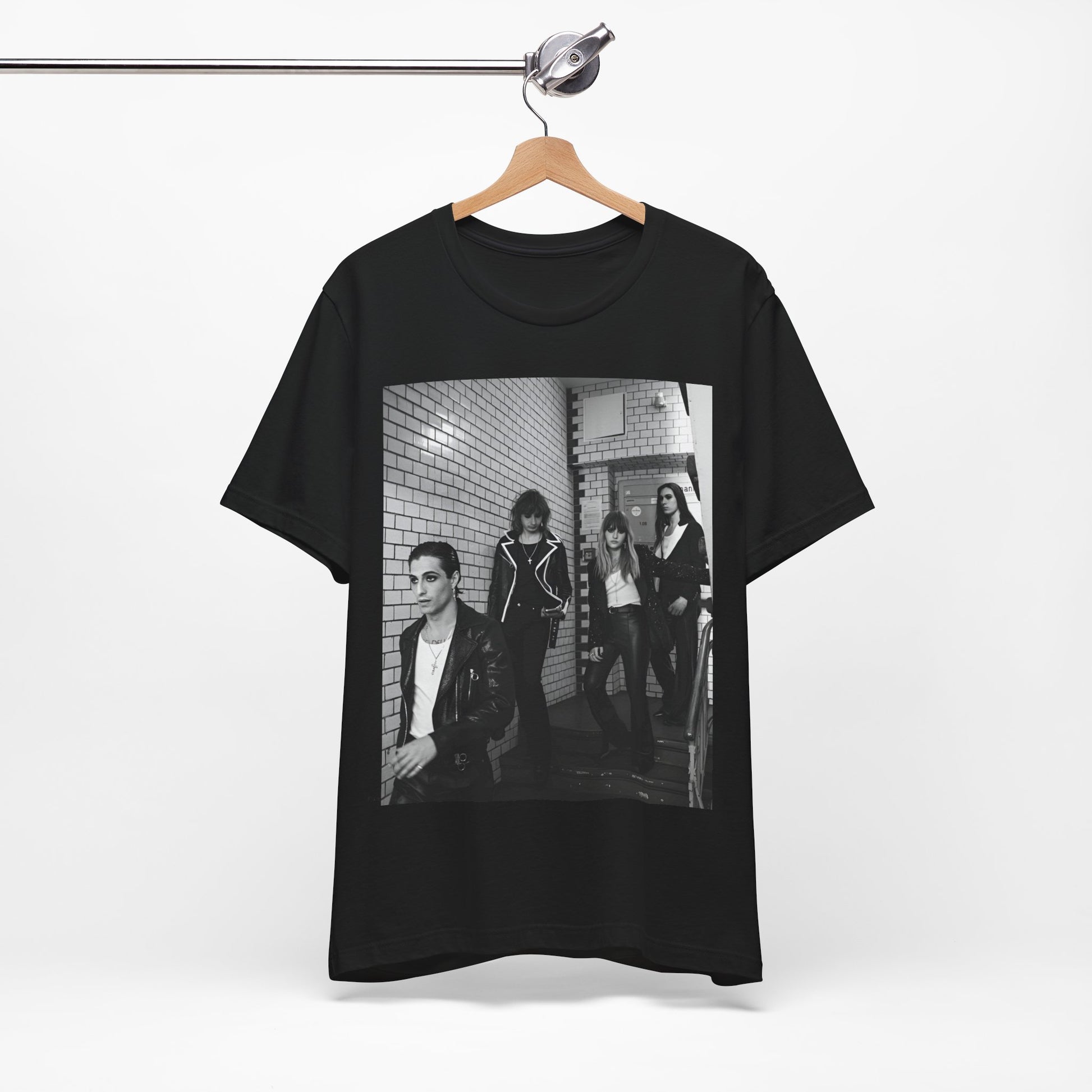 A black graphic t-shirt featuring a black and white graphic or photo of Maneskin in a backstage setting.