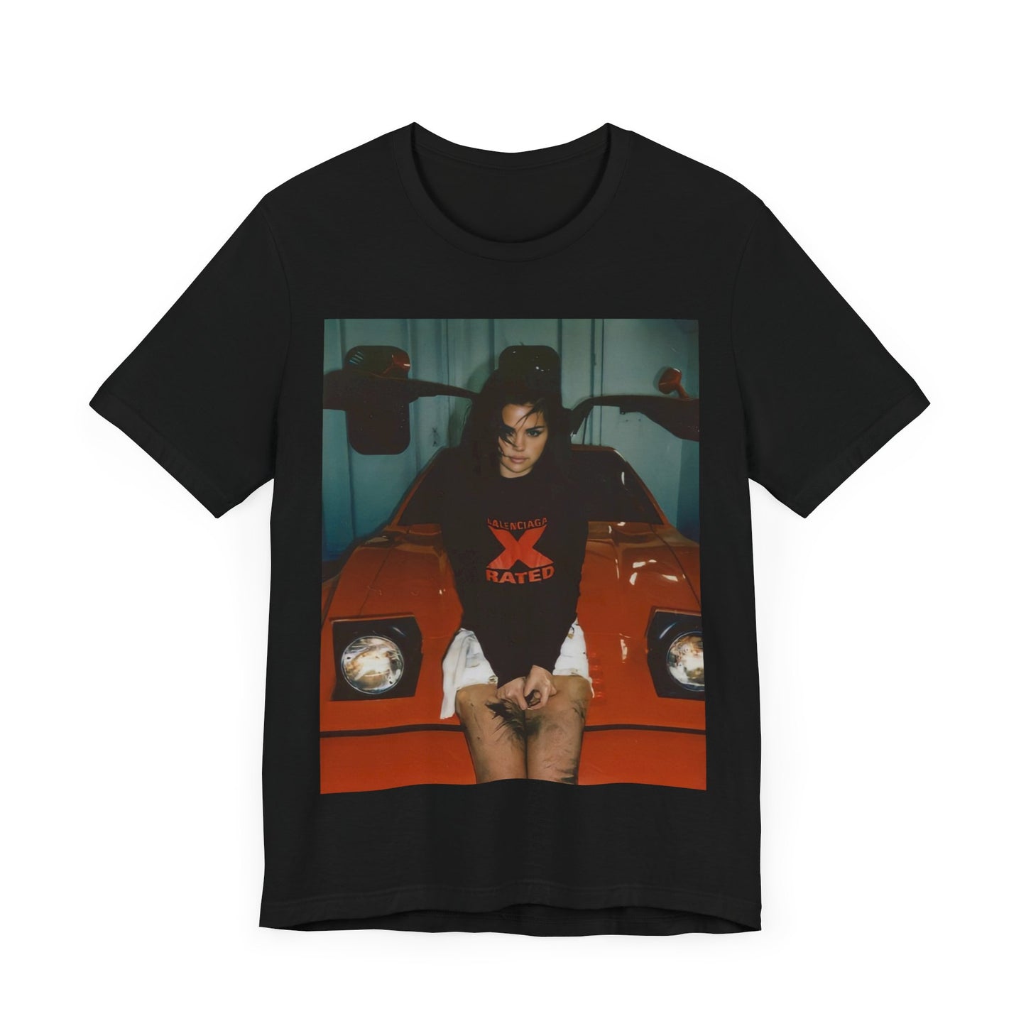 A black graphic t-shirt featuring a photo or graphic of Selena Gomez with a car, designed with an 'X Rated' or edgy aesthetic.