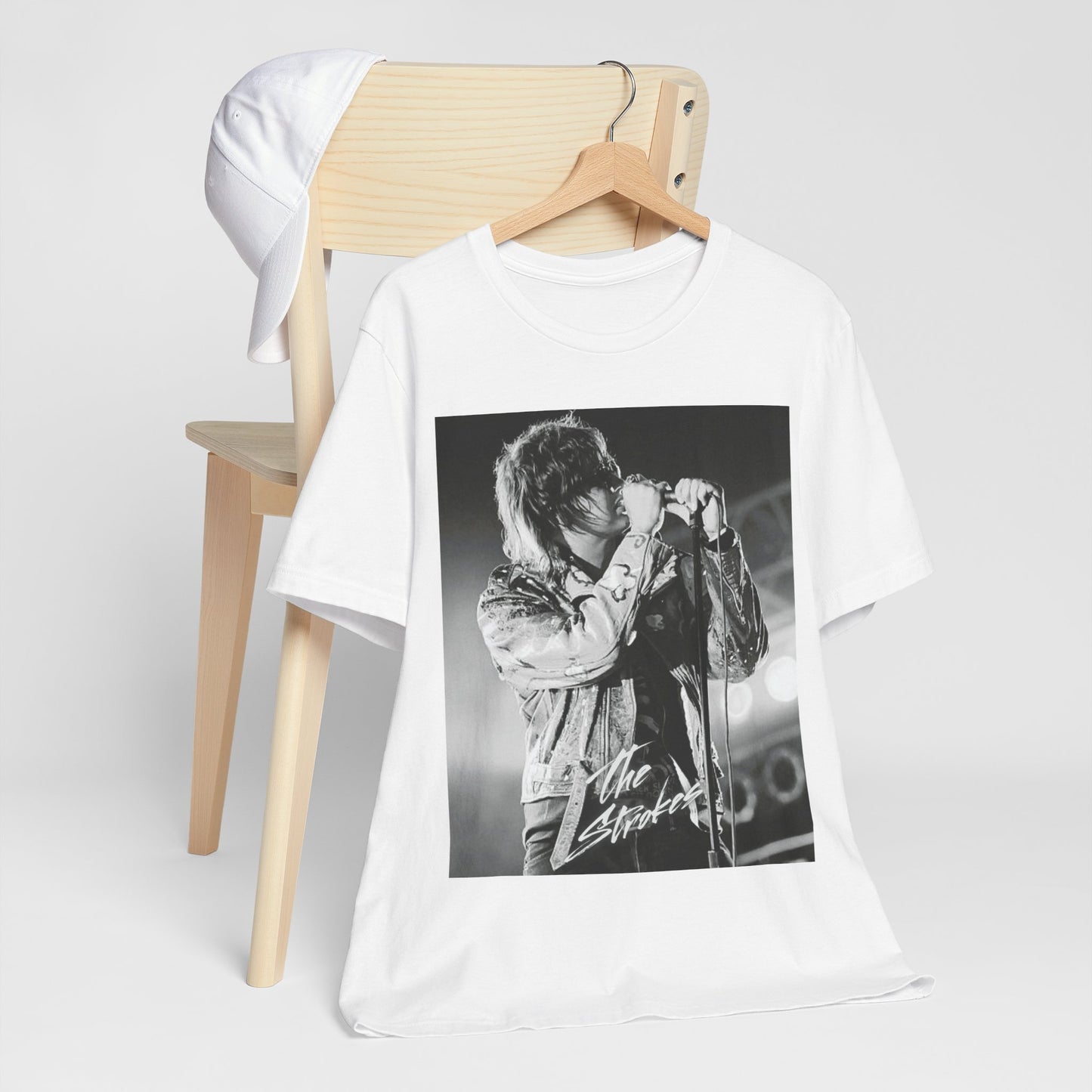 A black graphic t-shirt featuring a vintage graphic related to The Strokes' 'Last Nite' song or era.