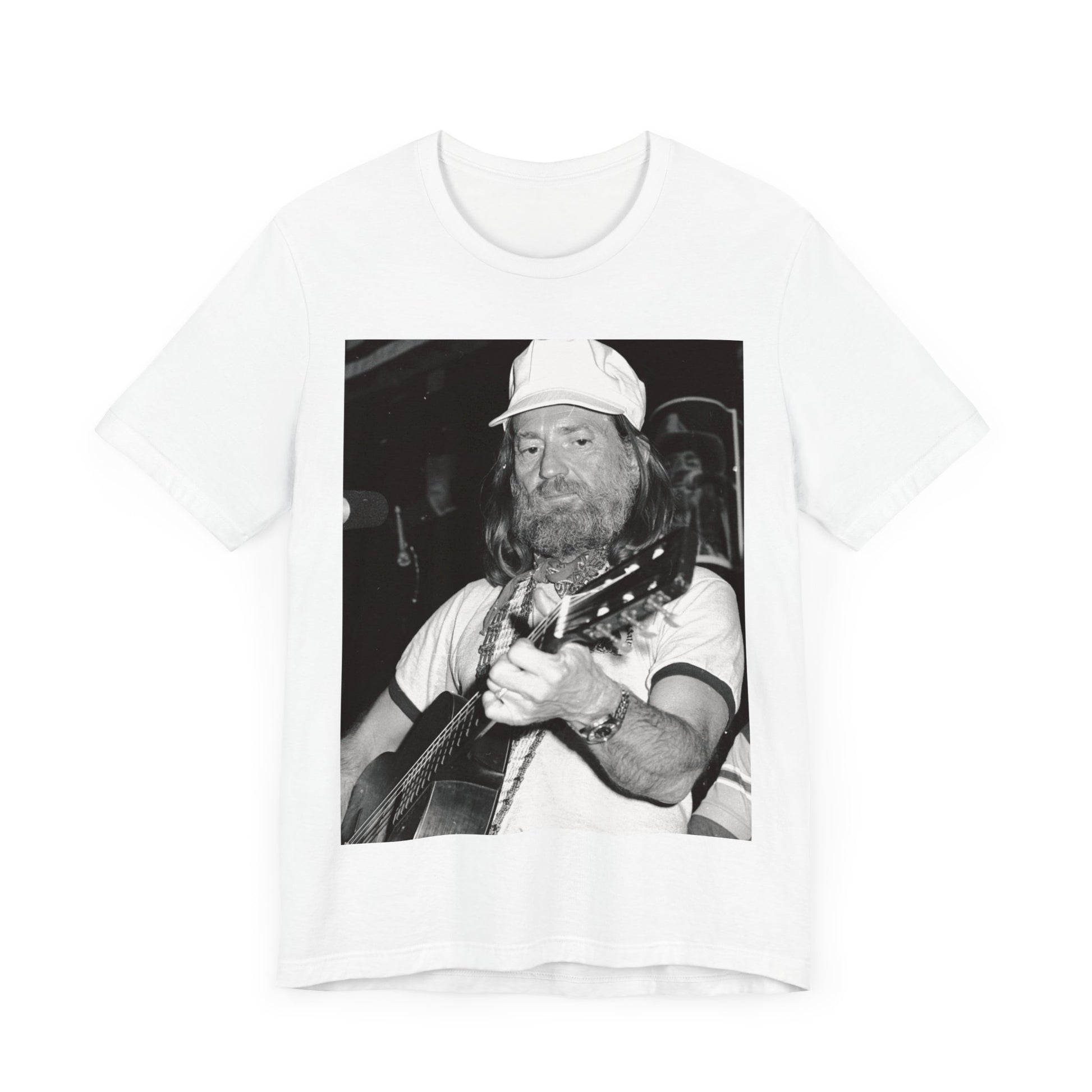 A black graphic t-shirt featuring a 70s cool free spirit graphic of Willie Nelson.