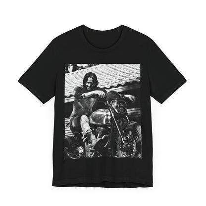 A black graphic t-shirt featuring a black and white photo of Keanu Reeves on a motorcycle.