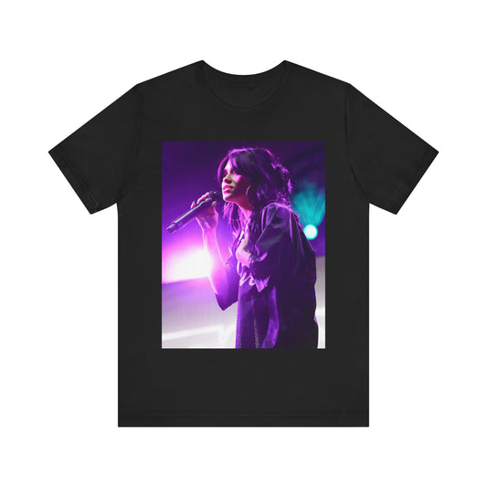 A black graphic t-shirt featuring a graphic or photo of Nessa Barrett performing live on stage.