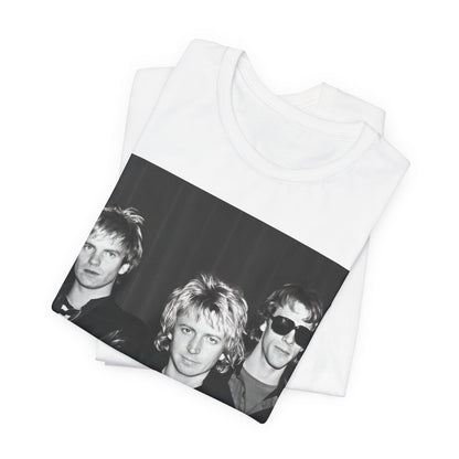 A black graphic t-shirt featuring a black and white, monochrome graphic or photo of The Police.