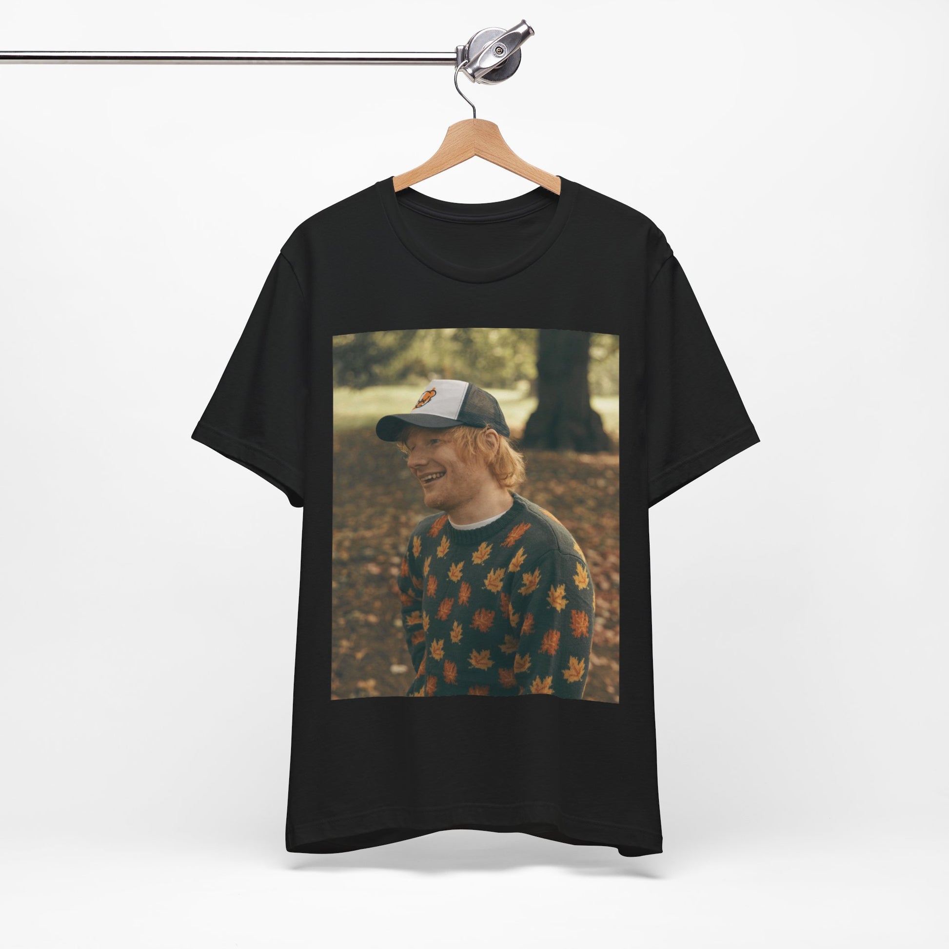 A black graphic t-shirt featuring a graphic related to Ed Sheeran's 'Shape of You' song or era.