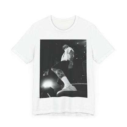 The abstract, geometric 'V' logo from the cover of the Maroon 5 album V, printed on a t-shirt.