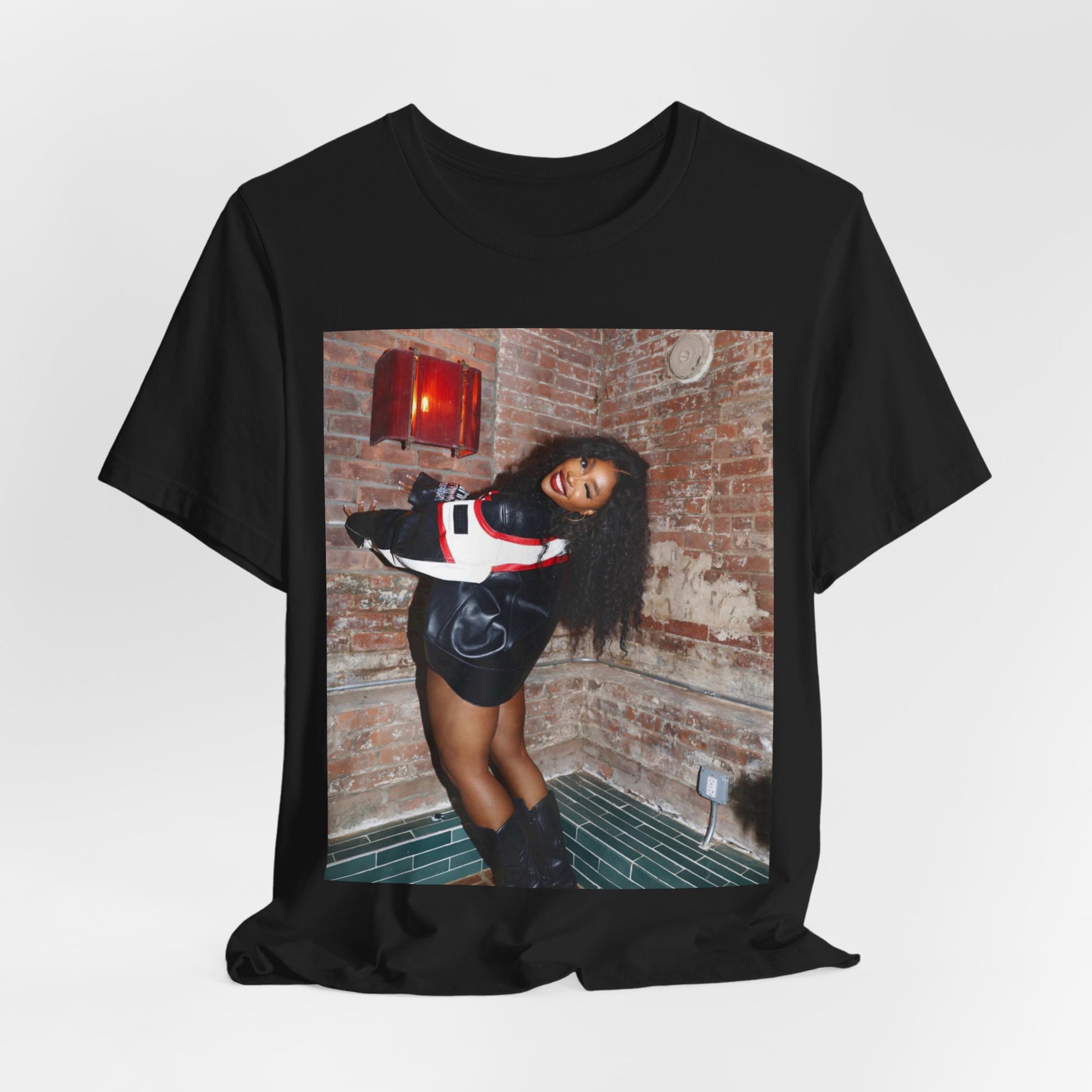 A black graphic t-shirt featuring a graphic of SZA as a TDE Queen R&B icon.
