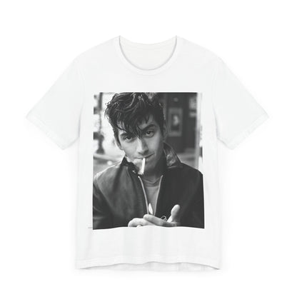 A black graphic t-shirt featuring a graphic of Alex Turner from Arctic Monkeys, in a rock star pose or setting.