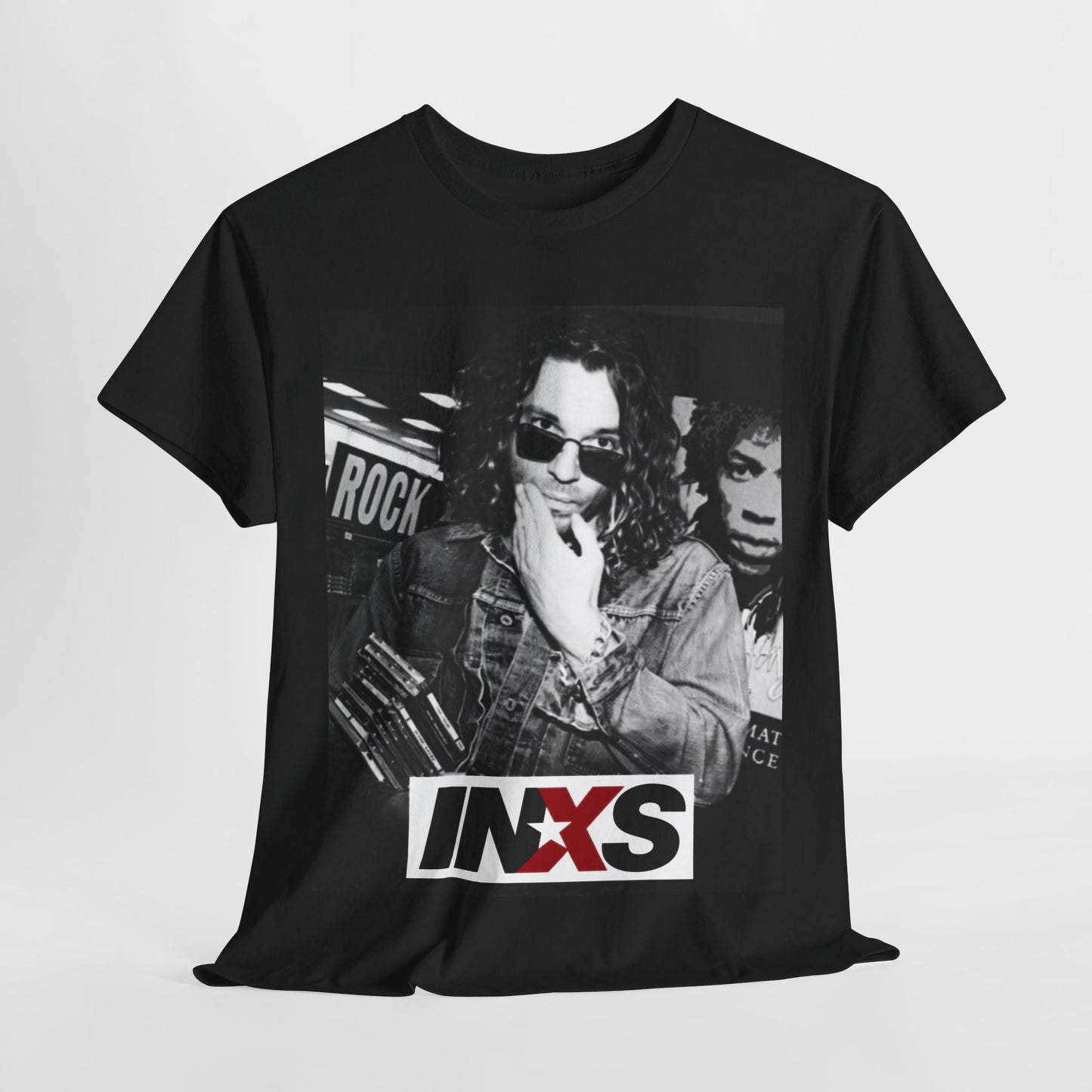 A black graphic t-shirt featuring a black and white, monochrome graphic or photo of INXS.
