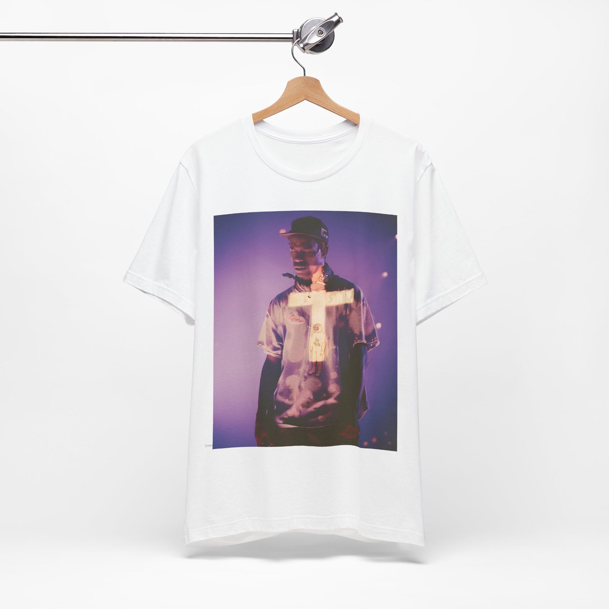 A black graphic t-shirt featuring a graphic of Travis Scott with dark fantasy vibes.