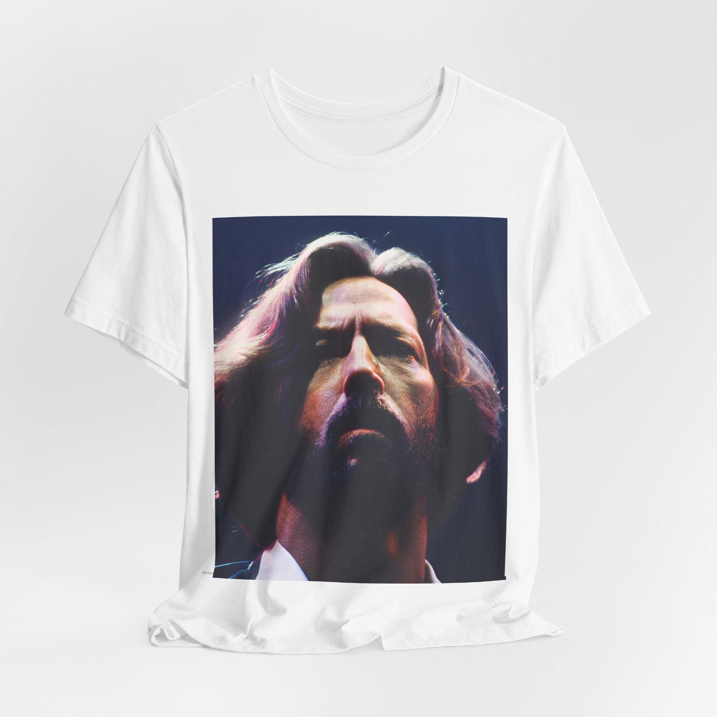 A black graphic t-shirt featuring a graphic related to Eric Clapton's 'Tears in Heaven' song or era.