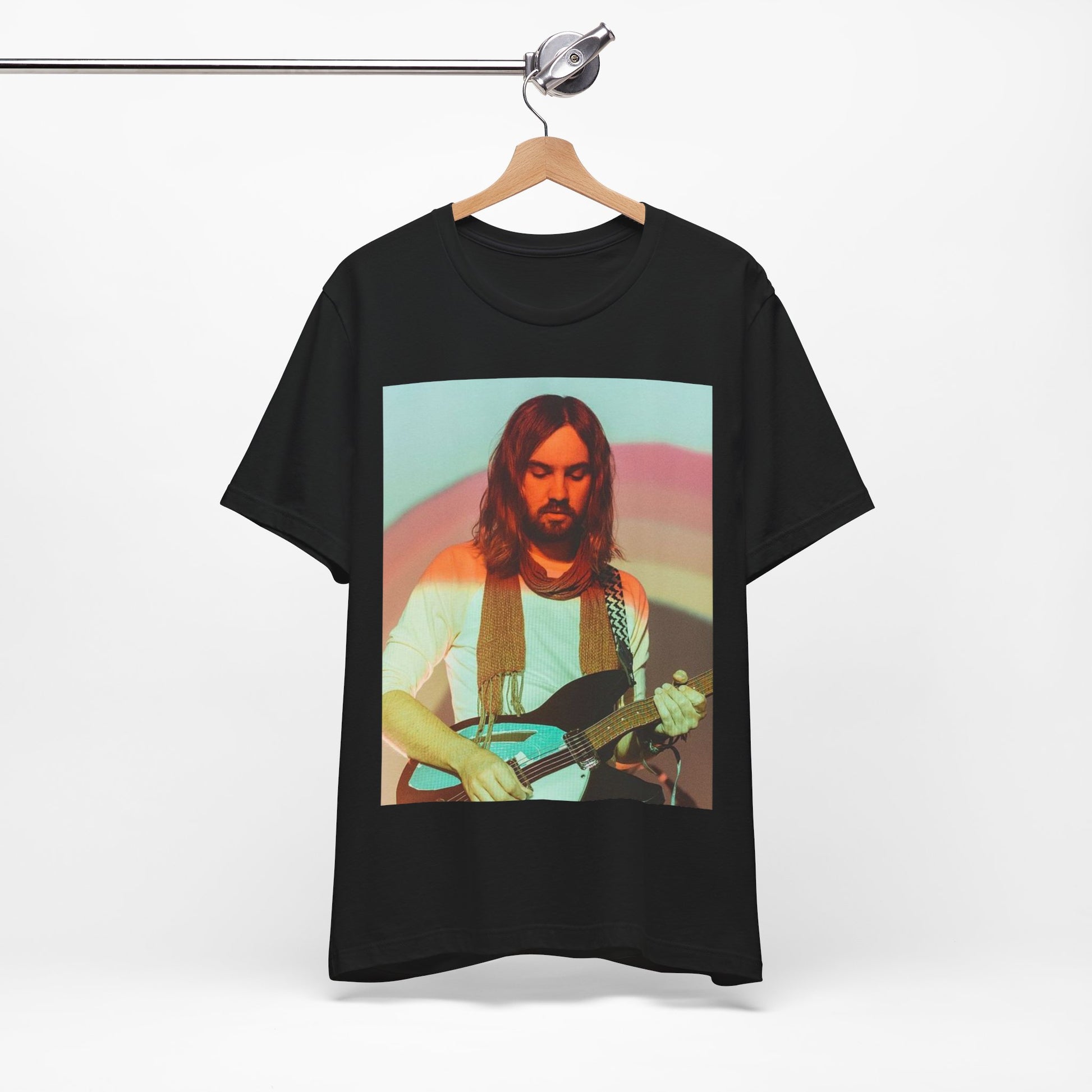 A black graphic t-shirt featuring a dream rock aesthetic graphic of Tame Impala.