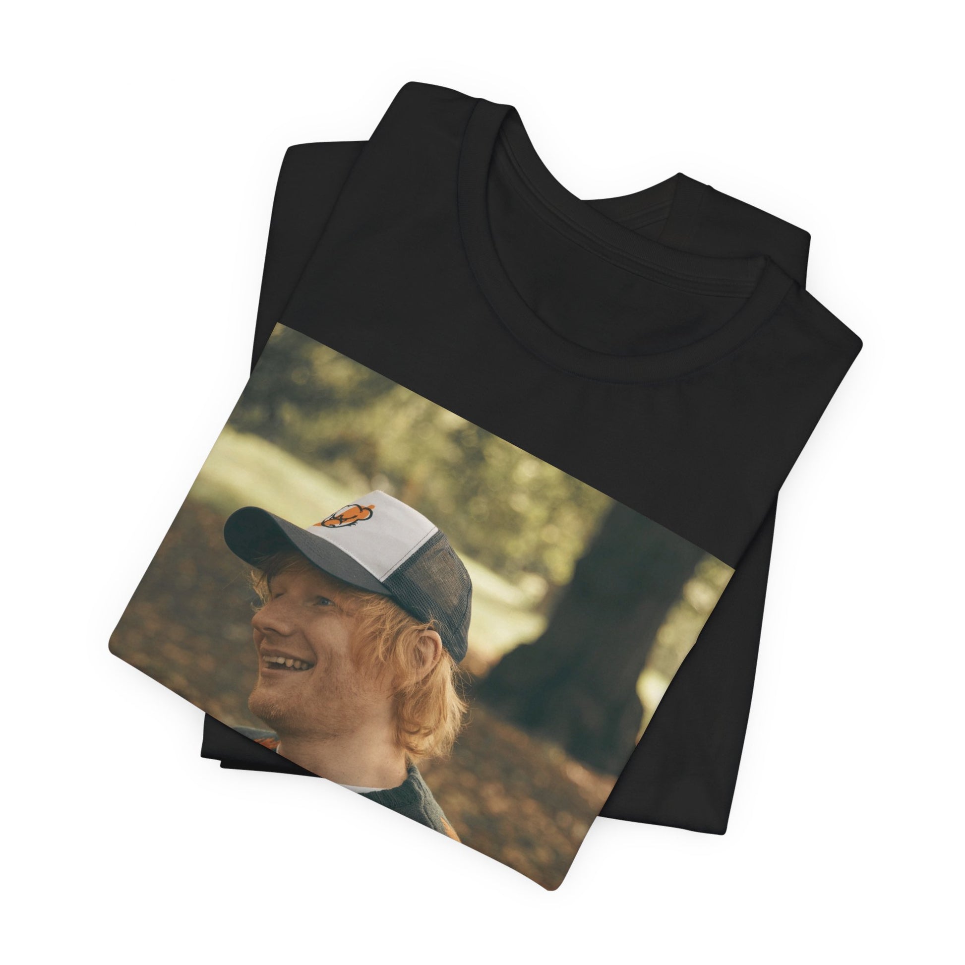 A black graphic t-shirt featuring a graphic related to Ed Sheeran's 'Shape of You' song or era.