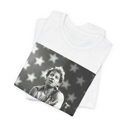 A black graphic t-shirt featuring a black and white graphic of Bruce Springsteen with an American flag background or elements.