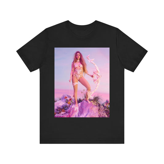 A black graphic t-shirt featuring a vintage ethereal warrior graphic of Shakira.