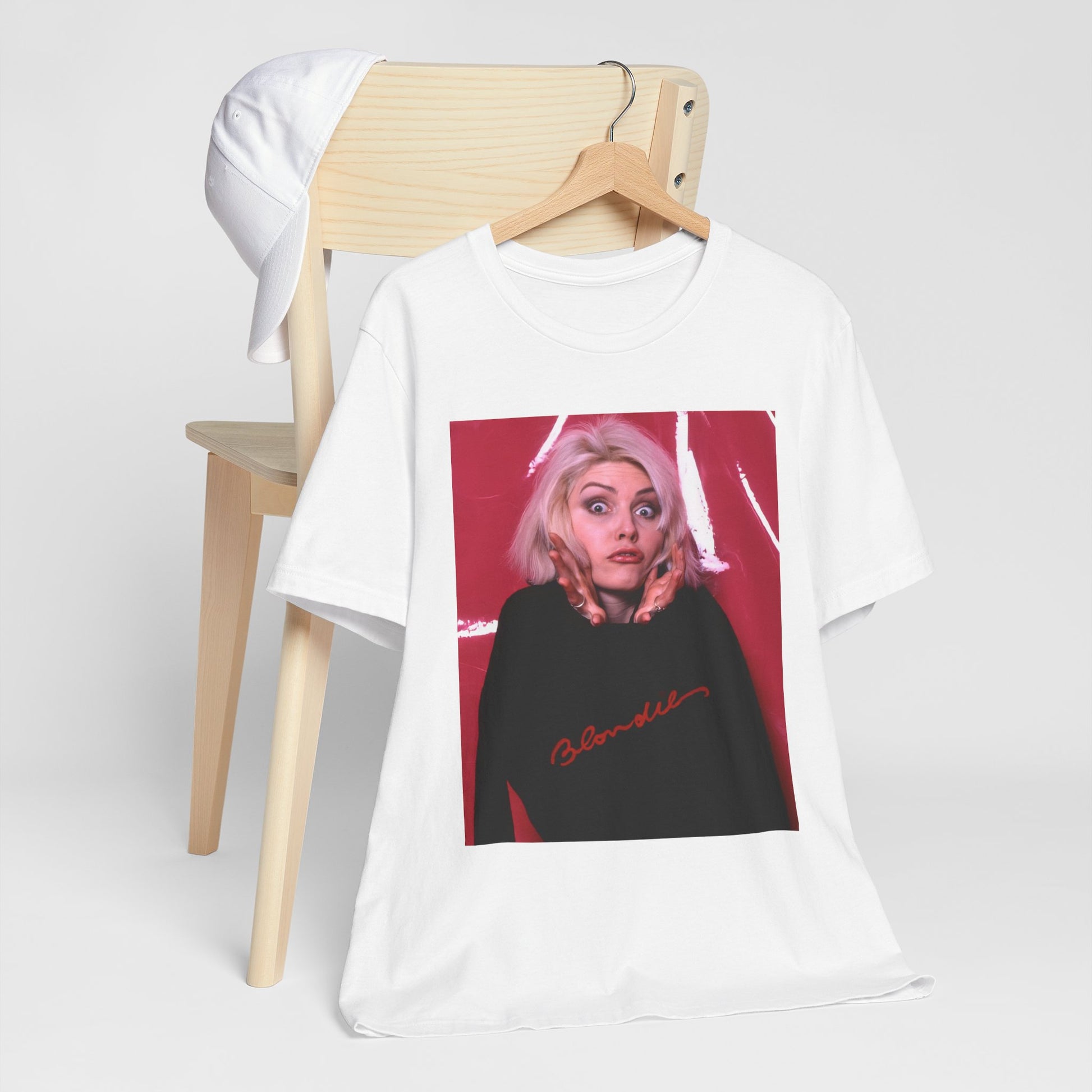 A black graphic t-shirt featuring a graphic related to Blondie's 'Atomic' song or era.