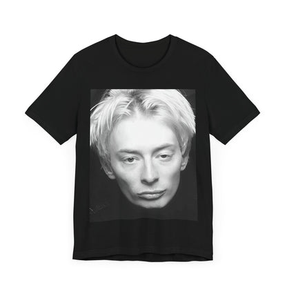 A black graphic t-shirt featuring a 90s black and white portrait photo of Thom Yorke from Radiohead.