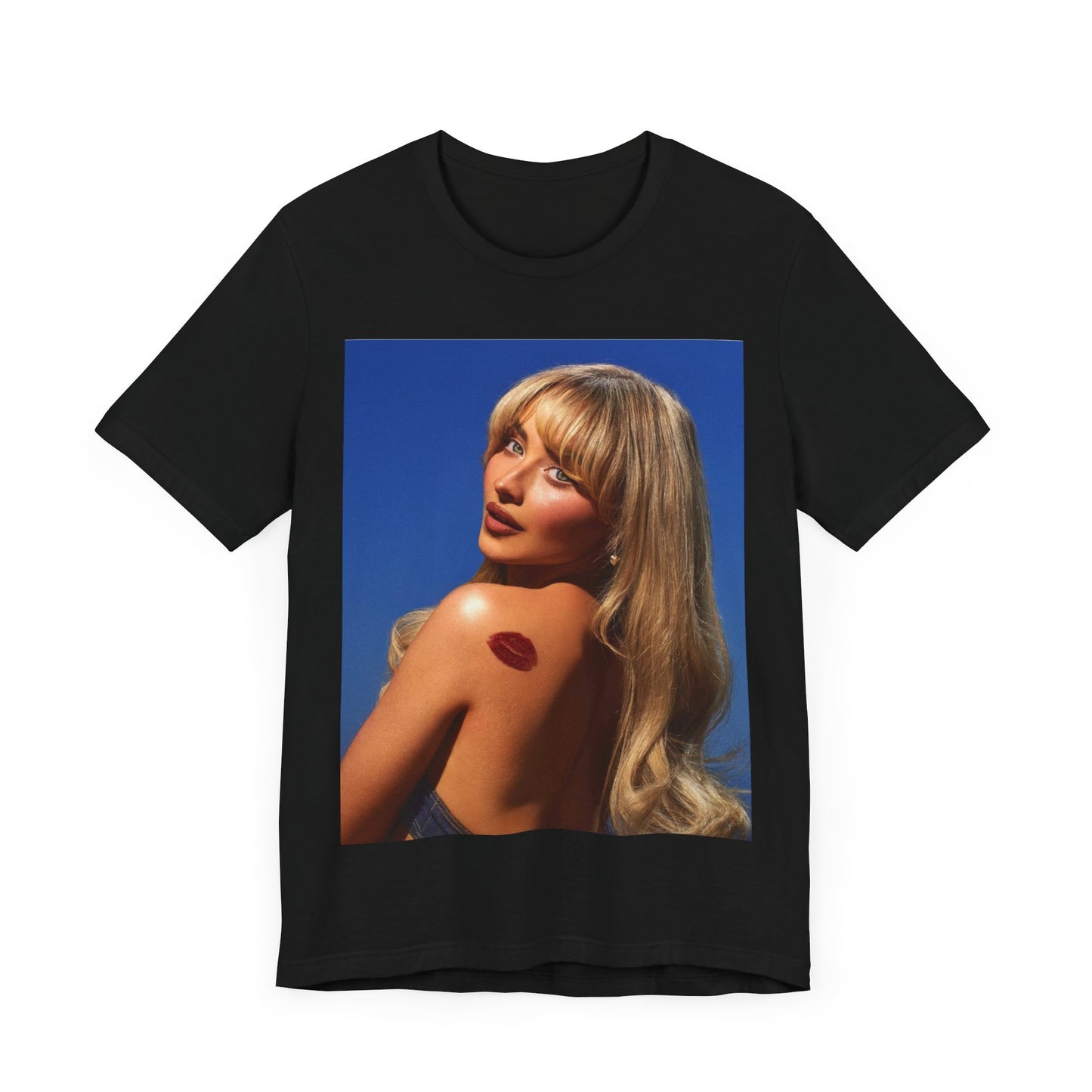 A black graphic t-shirt featuring a stylized graphic of Sabrina Carpenter, designed with a modern pop aesthetic.