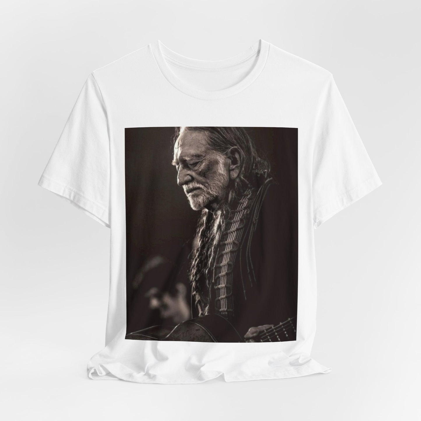 A black graphic t-shirt featuring a vintage country legend graphic of Willie Nelson.