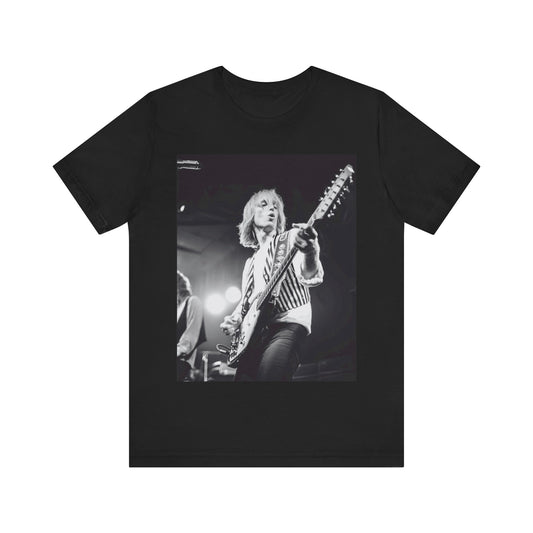 A black graphic t-shirt featuring a graphic of Tom Petty as a Rock & Roll Hall of Fame icon.