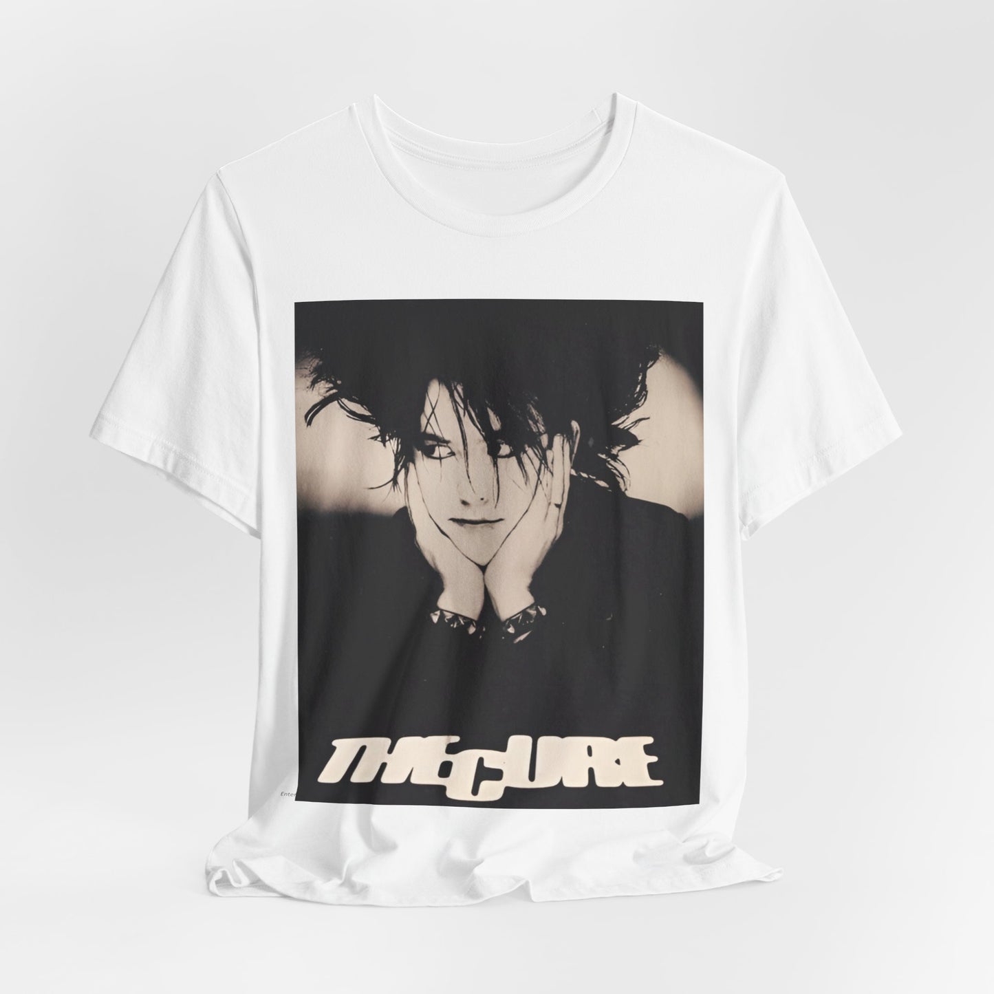 A black graphic t-shirt featuring a graphic of The Cure with cool new wave vibes.