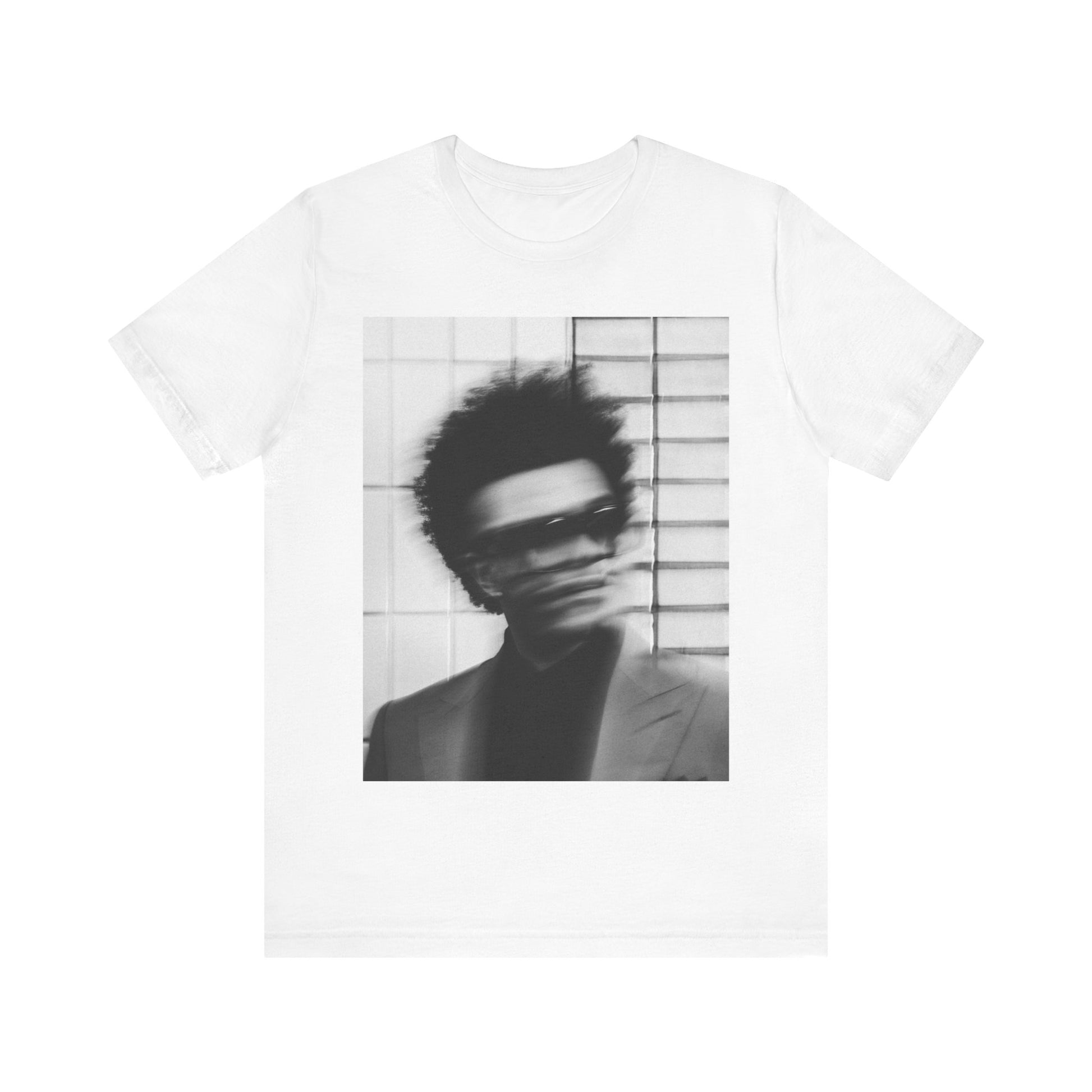 A black graphic t-shirt featuring a blurred graphic of The Weeknd from his 'After Hours' era.