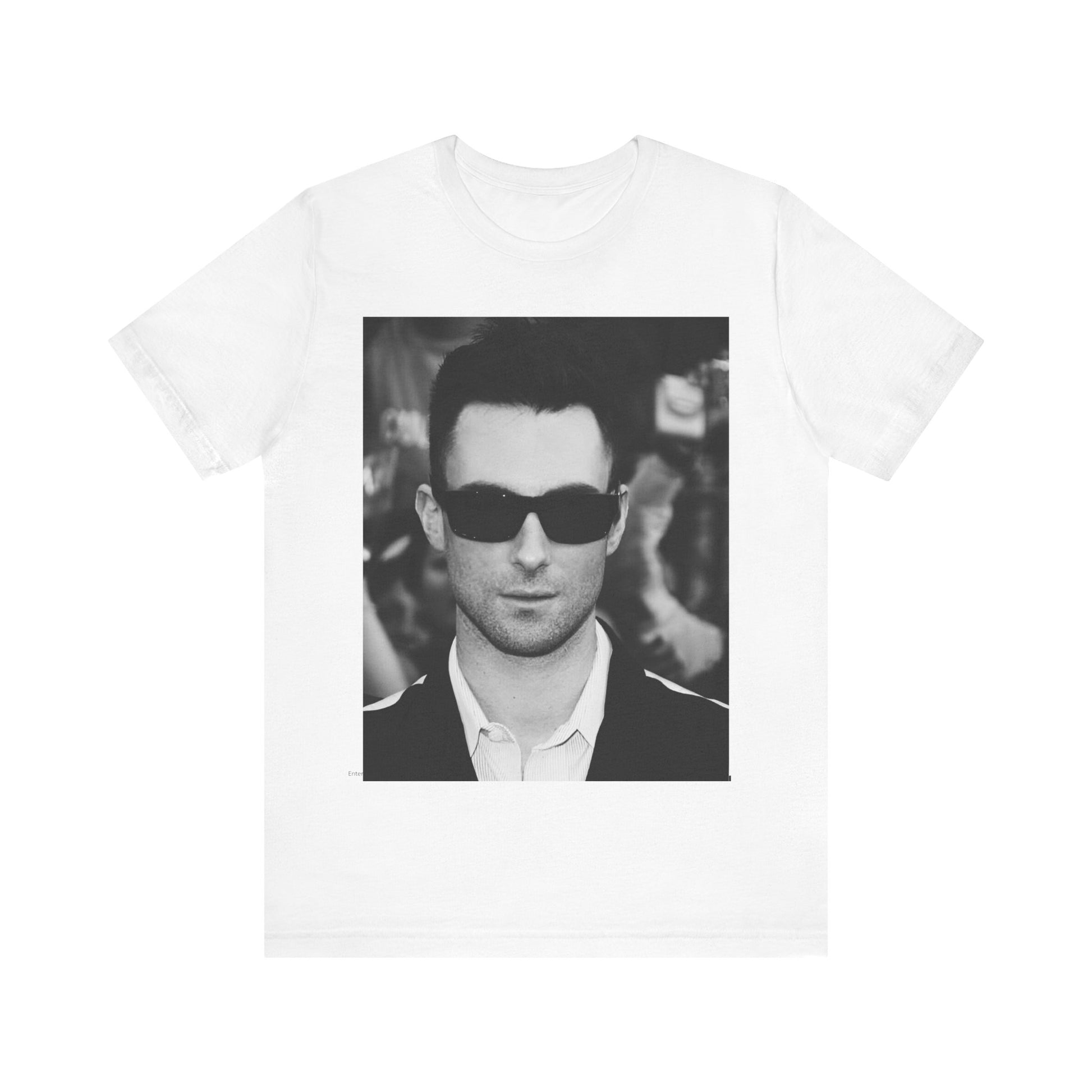 A black and white high-fashion photoshoot photo of Adam Levine, frontman of Maroon 5, looking confidently at the camera.