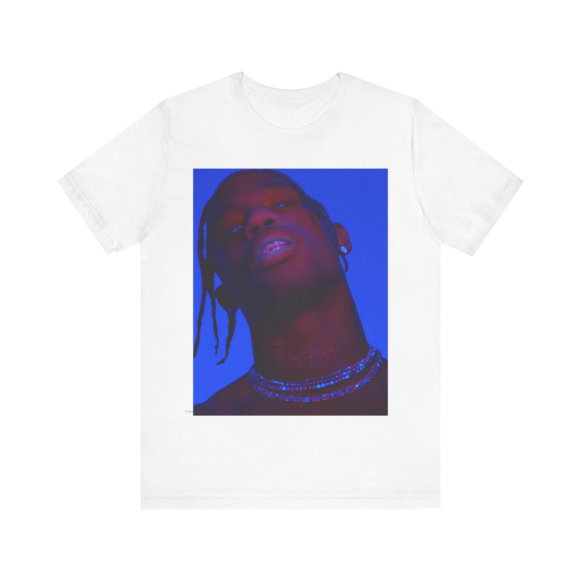 A black graphic t-shirt featuring a bold graphic of Travis Scott as a rap superstar.