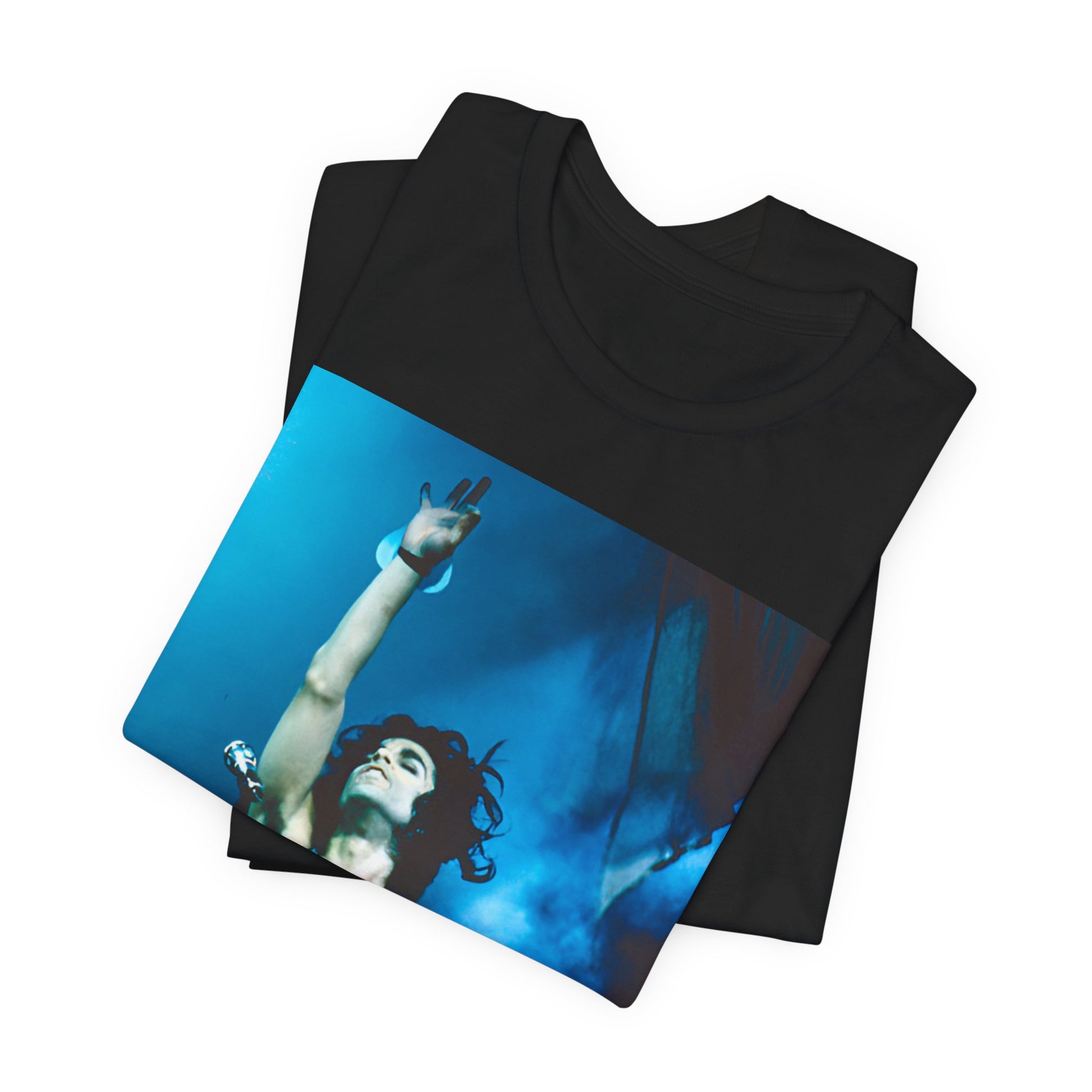 A black graphic t-shirt featuring a graphic of Prince as a guitar god and virtuoso performer.