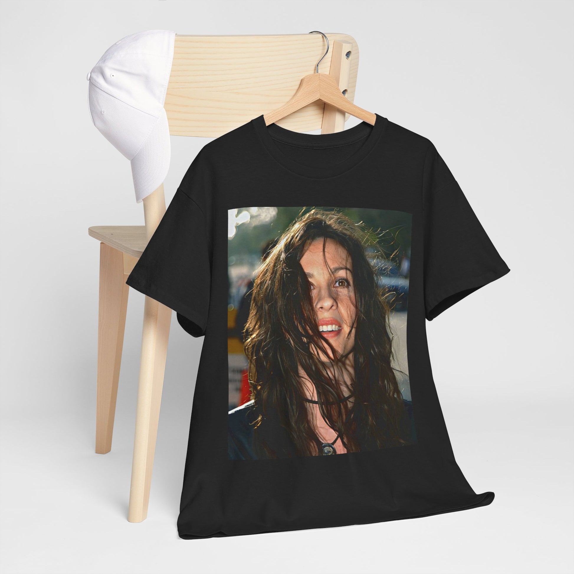 A black graphic t-shirt featuring a stylized graphic of Alanis Morissette from her 90s grunge era, with a raw and intense aesthetic.