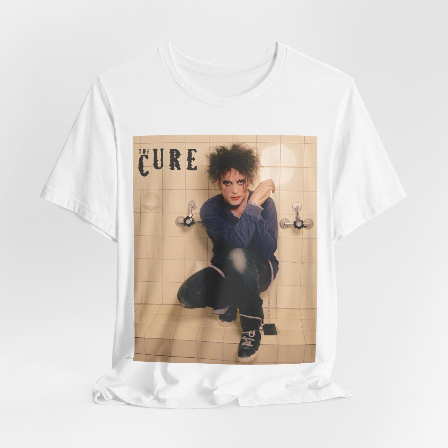 A black graphic t-shirt featuring a graphic related to The Cure's 'Friday I'm In Love' song or era.