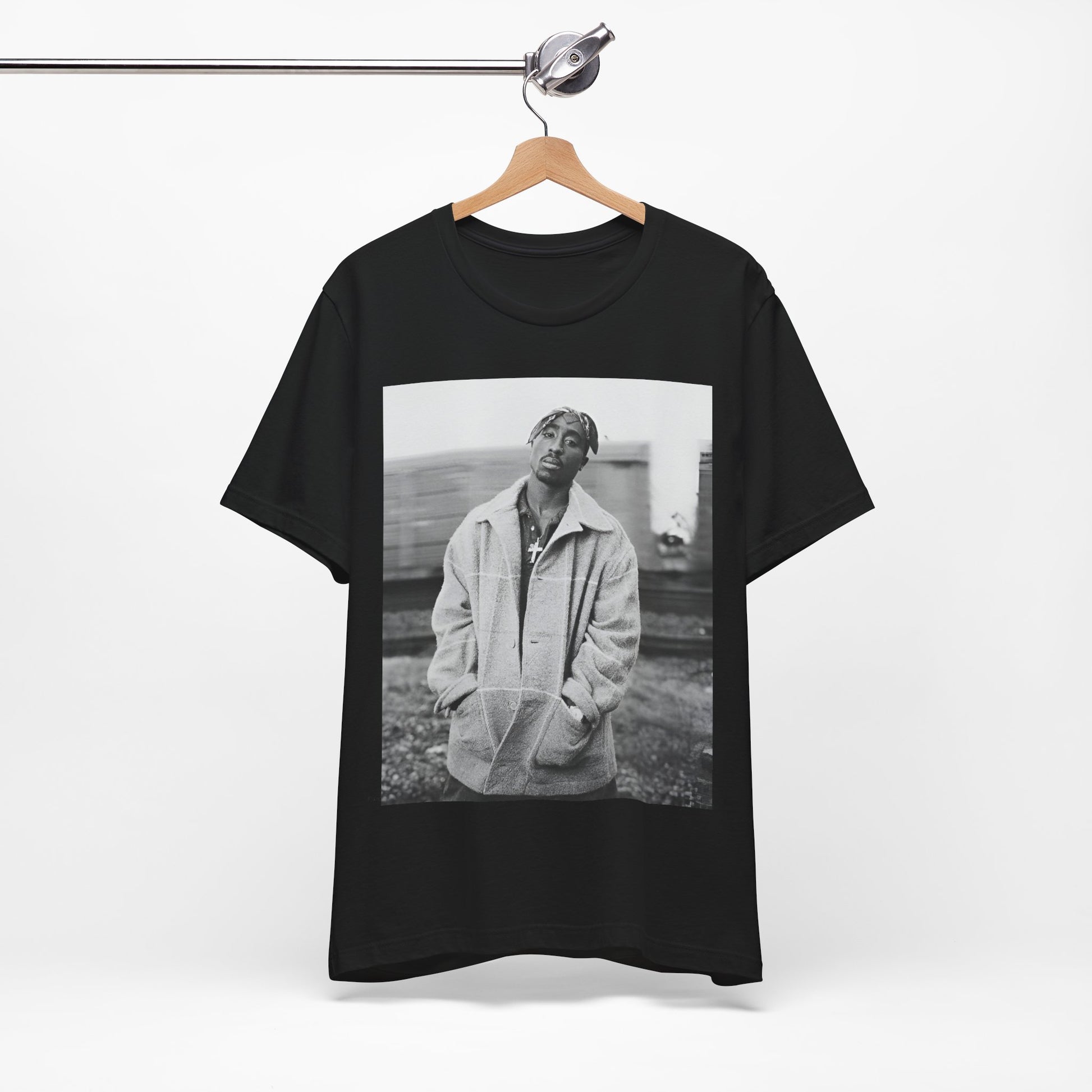 A black graphic t-shirt featuring a graphic related to Tupac's 'Thug Life' philosophy.