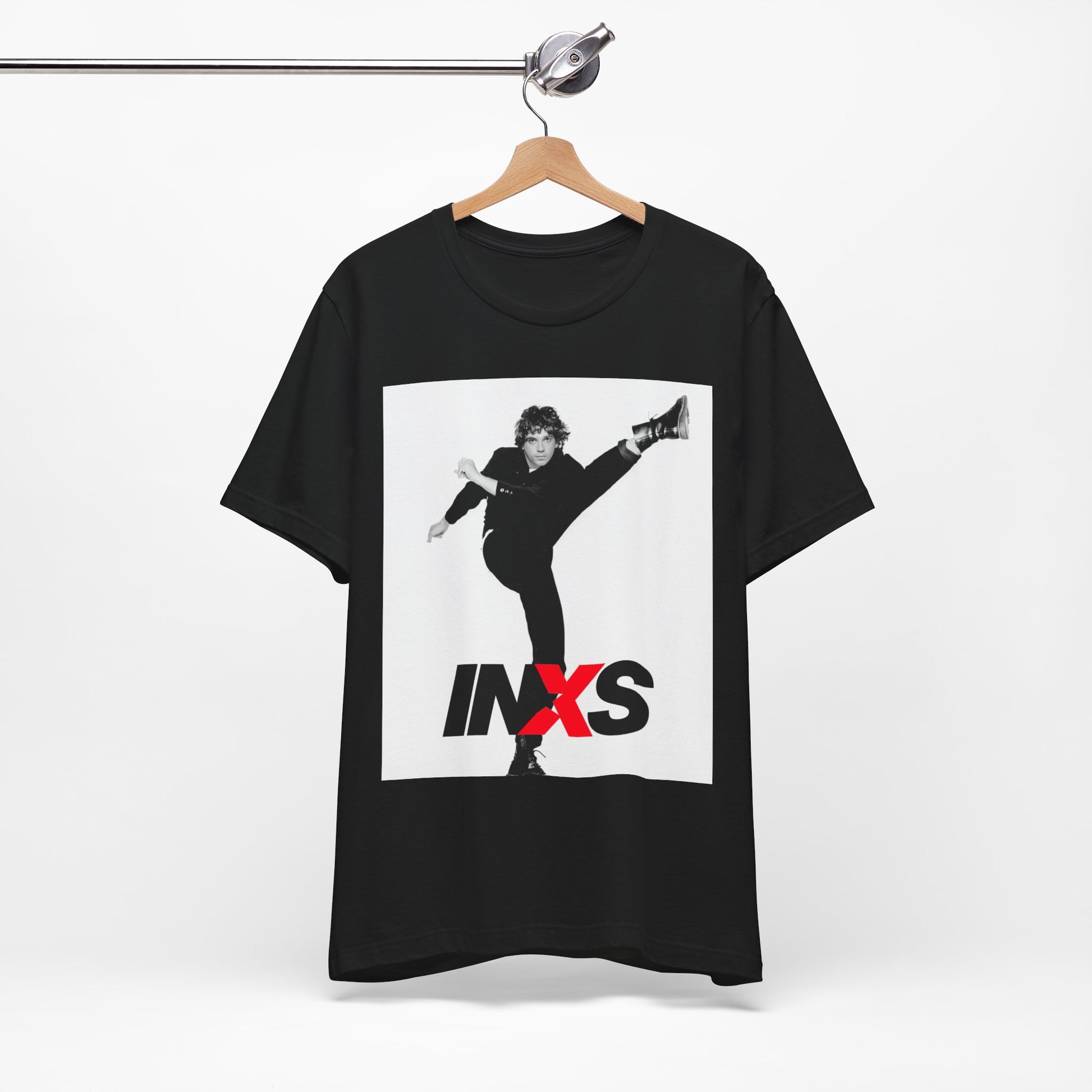 A black graphic t-shirt featuring a retro graphic related to INXS's 'Kick' album era.