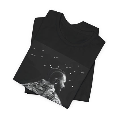 A black graphic t-shirt featuring a black and white graphic or photo of Drake performing live on stage.