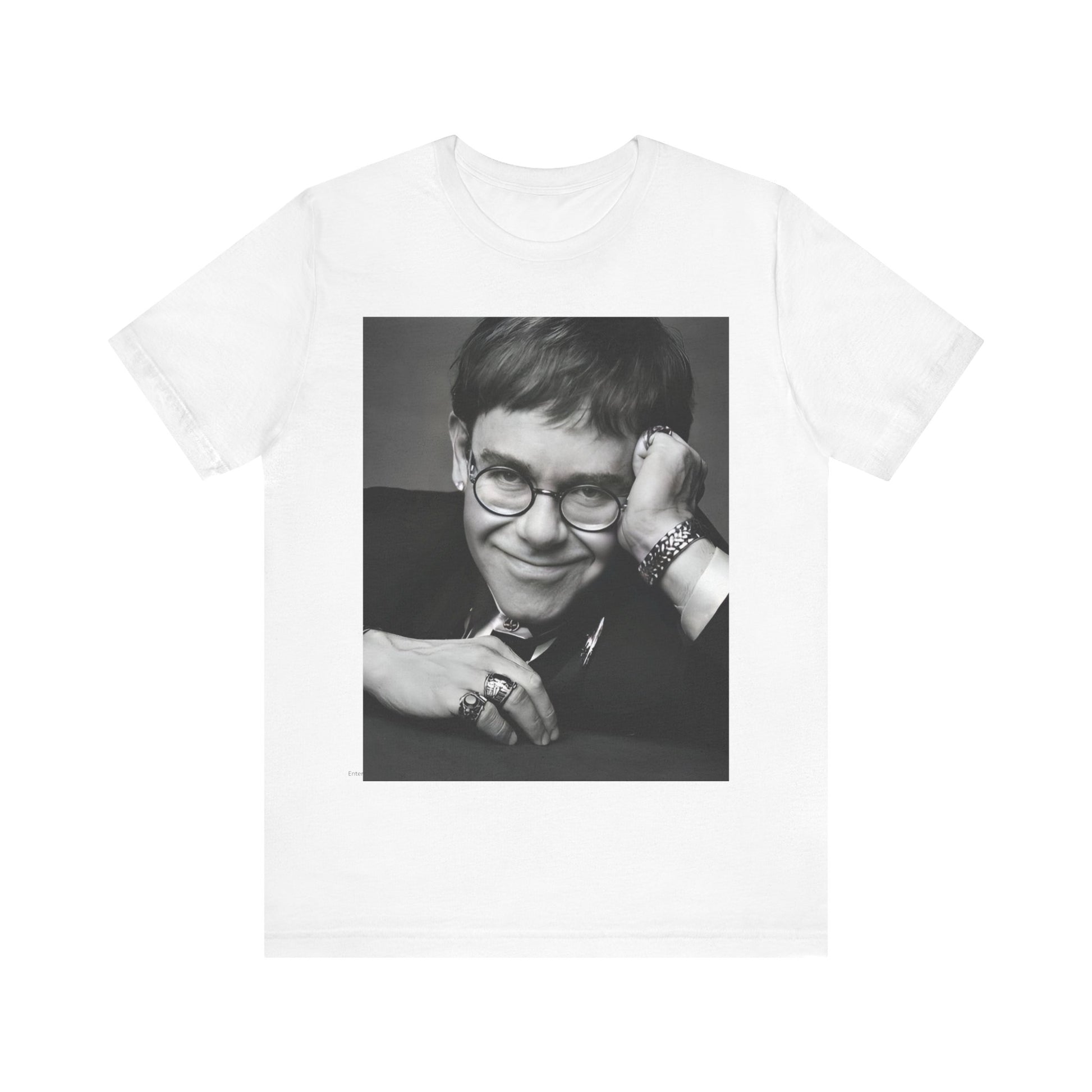 A black graphic t-shirt featuring a retro black and white photo portrait of Elton John.