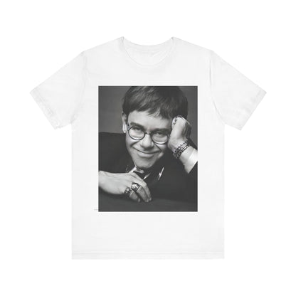 A black graphic t-shirt featuring a retro black and white photo portrait of Elton John.