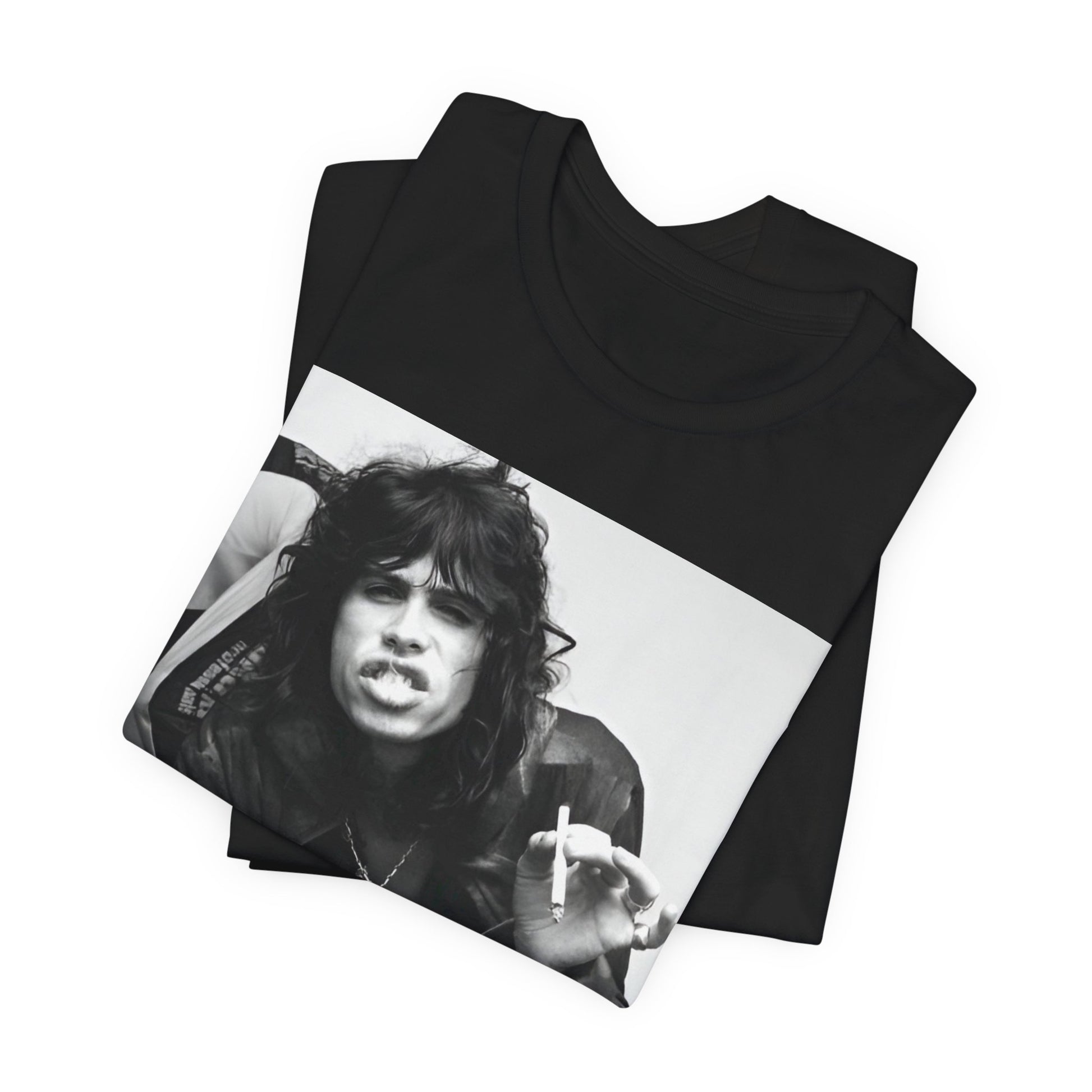 A black graphic t-shirt featuring a retro 70s photo of Aerosmith band members lounging in leather, exuding a cool, classic rock vibe.