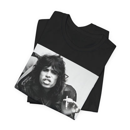 A black graphic t-shirt featuring a retro 70s photo of Aerosmith band members lounging in leather, exuding a cool, classic rock vibe.