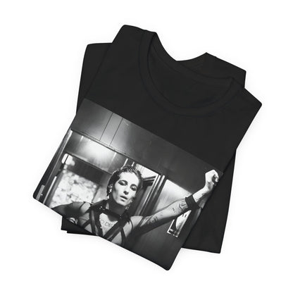 A black graphic t-shirt featuring a graphic of Maneskin emphasizing a rebel rock spirit.