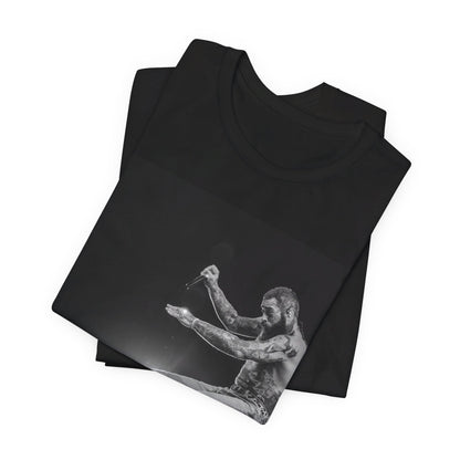 A black graphic t-shirt featuring a vintage graphic or photo of Post Malone performing live.