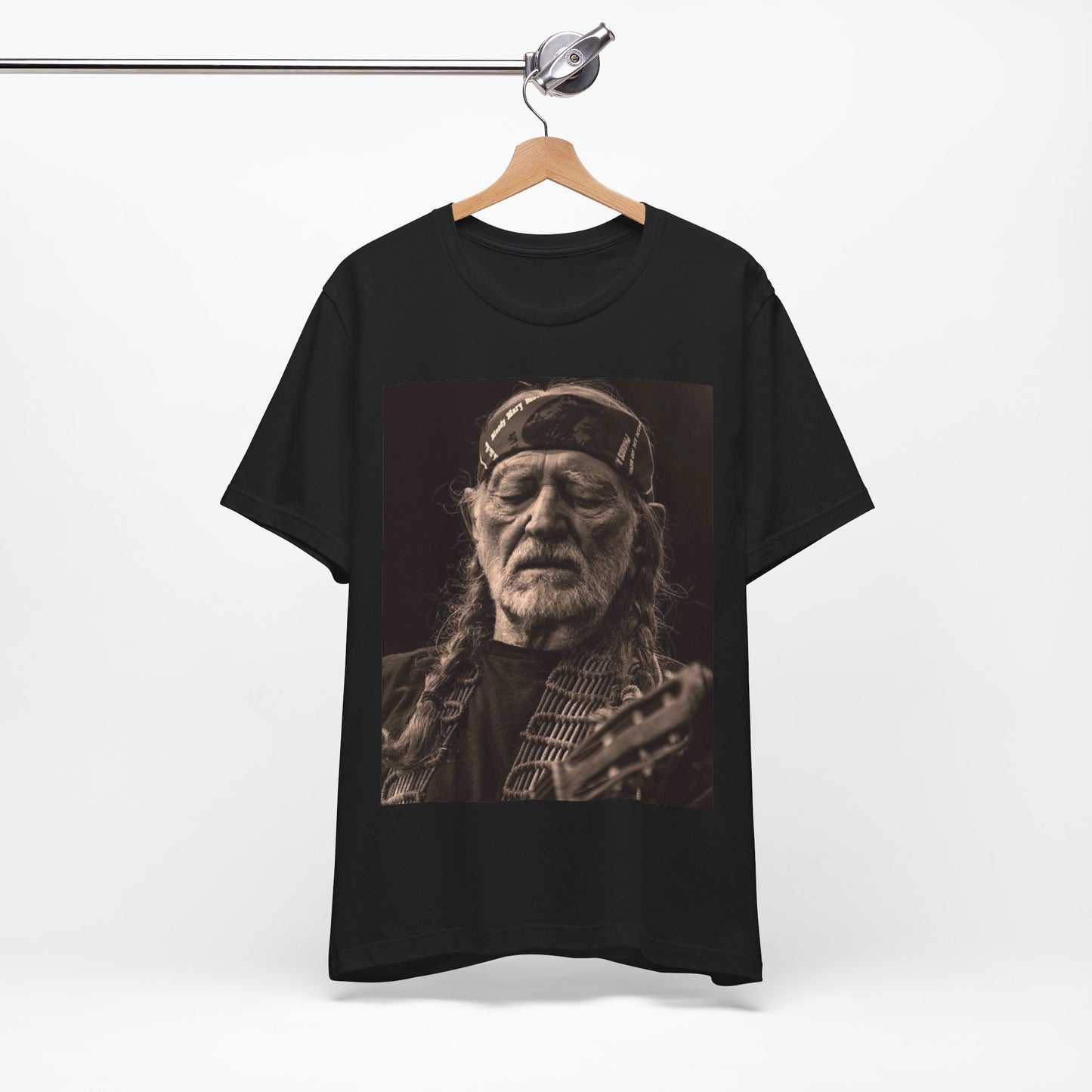 A black graphic t-shirt featuring a graphic of Willie Nelson with his iconic braids style.
