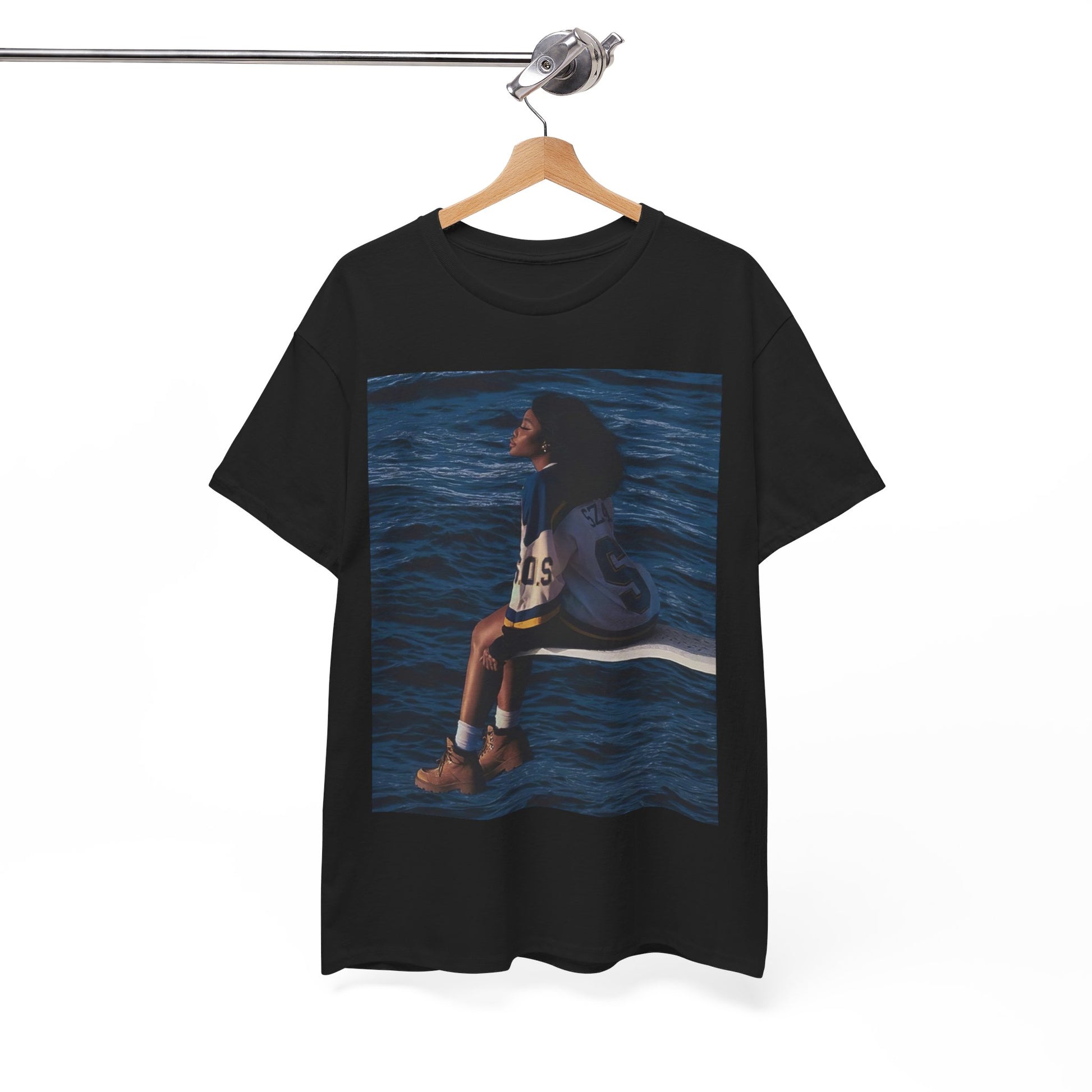 A black graphic t-shirt featuring a graphic related to SZA's 'SOS' album.
