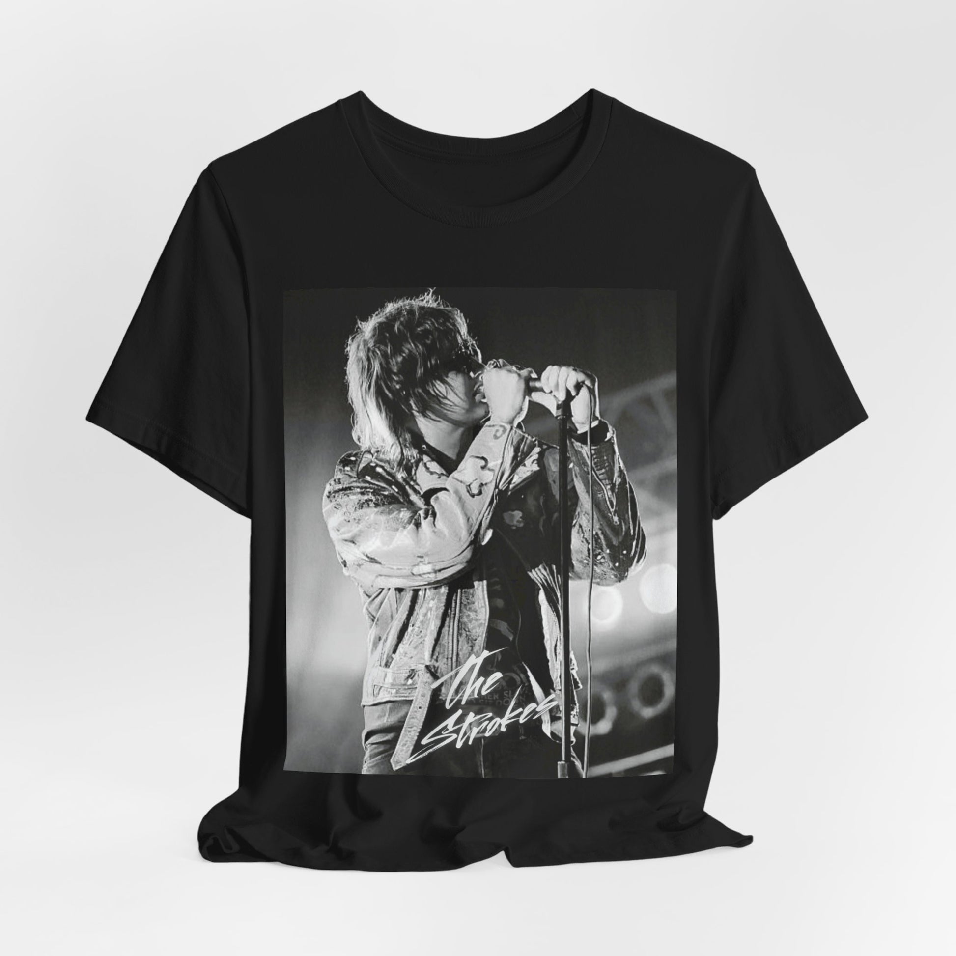 A black graphic t-shirt featuring a vintage graphic related to The Strokes' 'Last Nite' song or era.