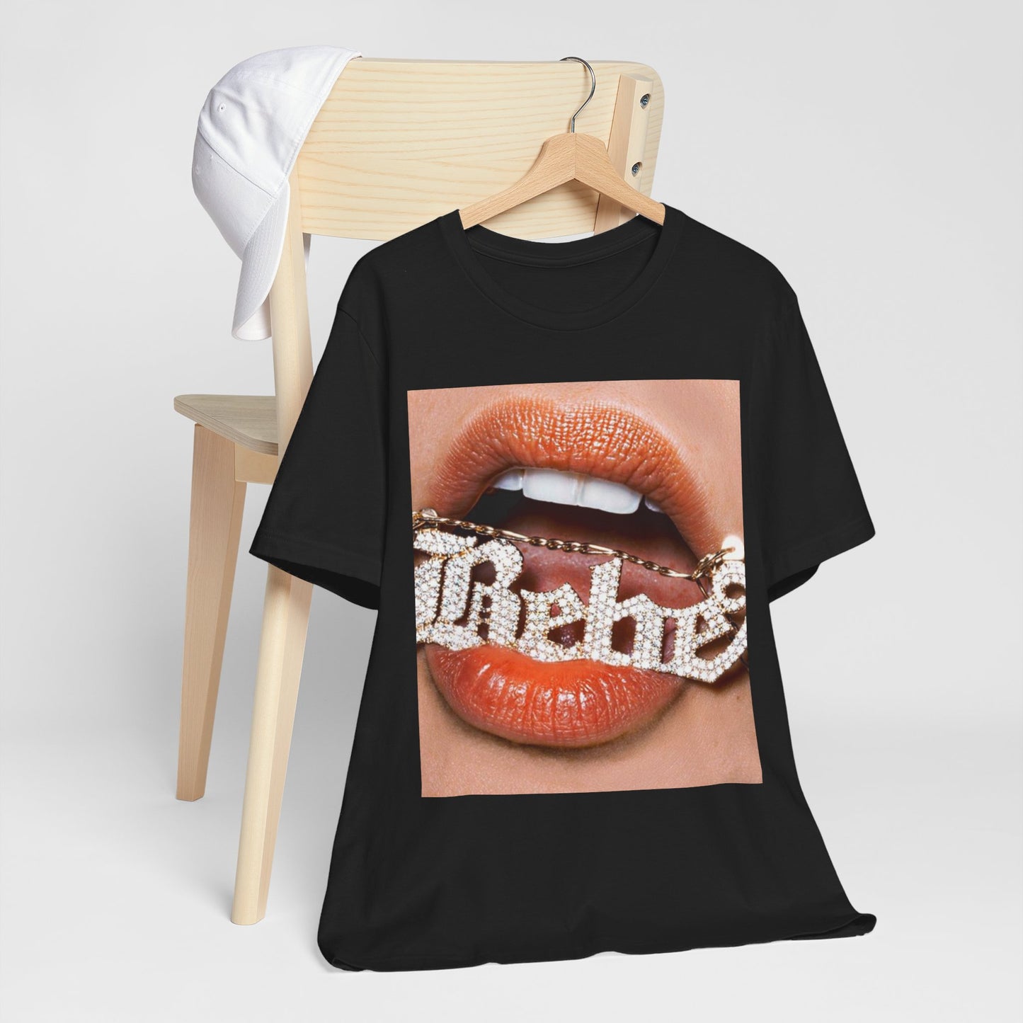 A black graphic t-shirt featuring a retro-style graphic inspired by Bebe Rexha's album art.