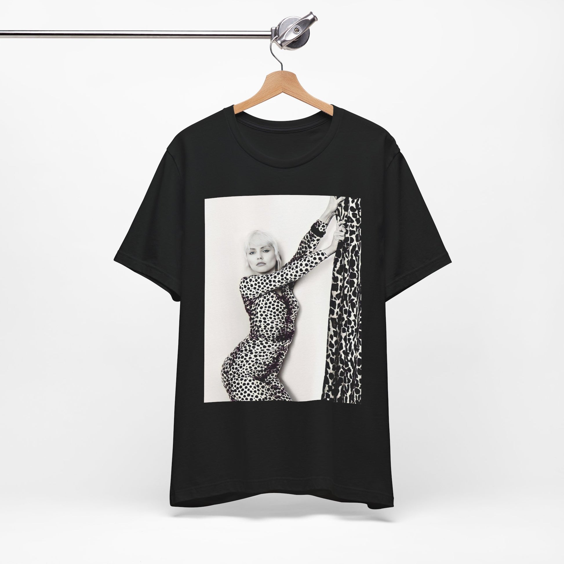 A black graphic t-shirt featuring a black and white, wild-style graphic of Blondie, emphasizing their untamed spirit.