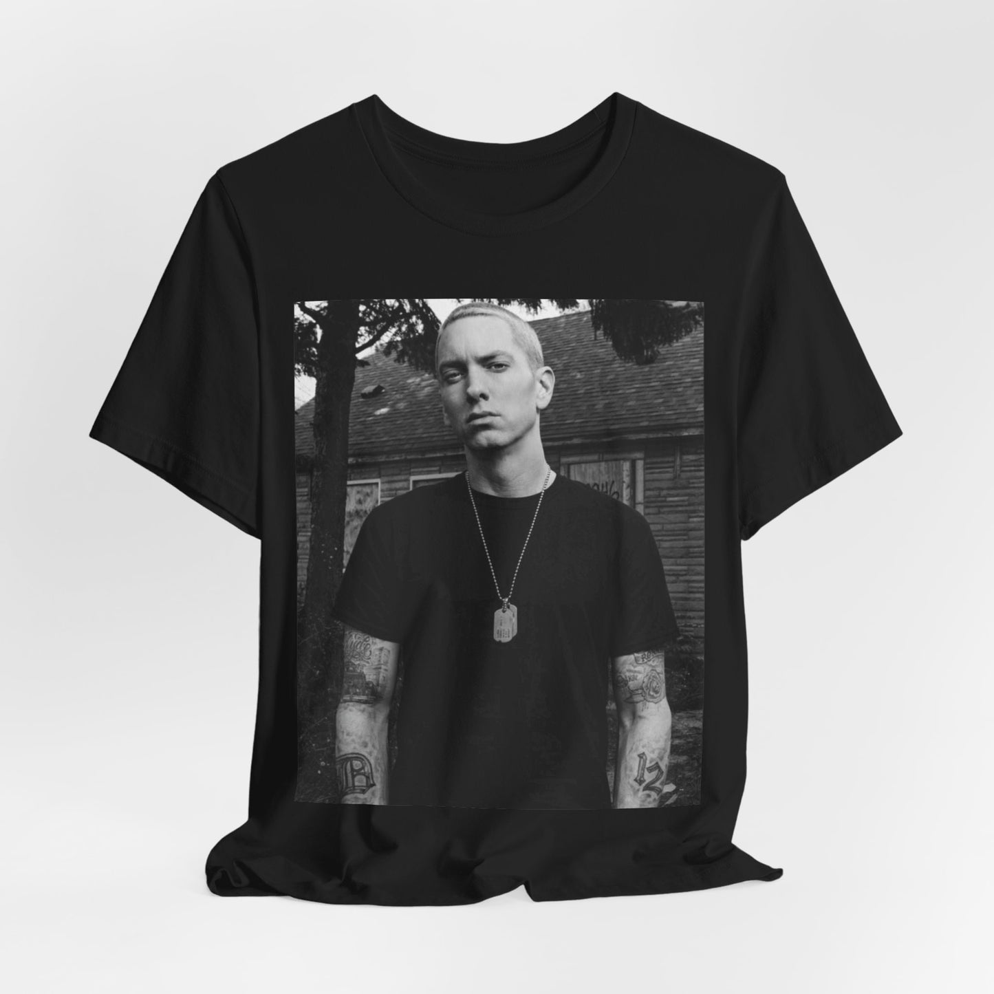 A black graphic t-shirt featuring a black and white graphic of Eminem as Slim Shady.