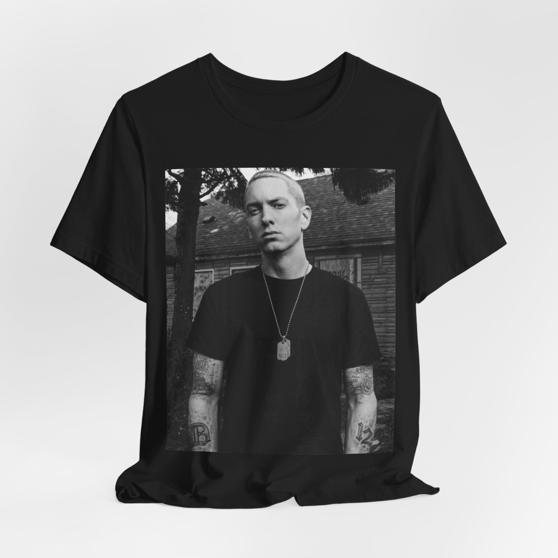 A black graphic t-shirt featuring a black and white graphic of Eminem as Slim Shady.