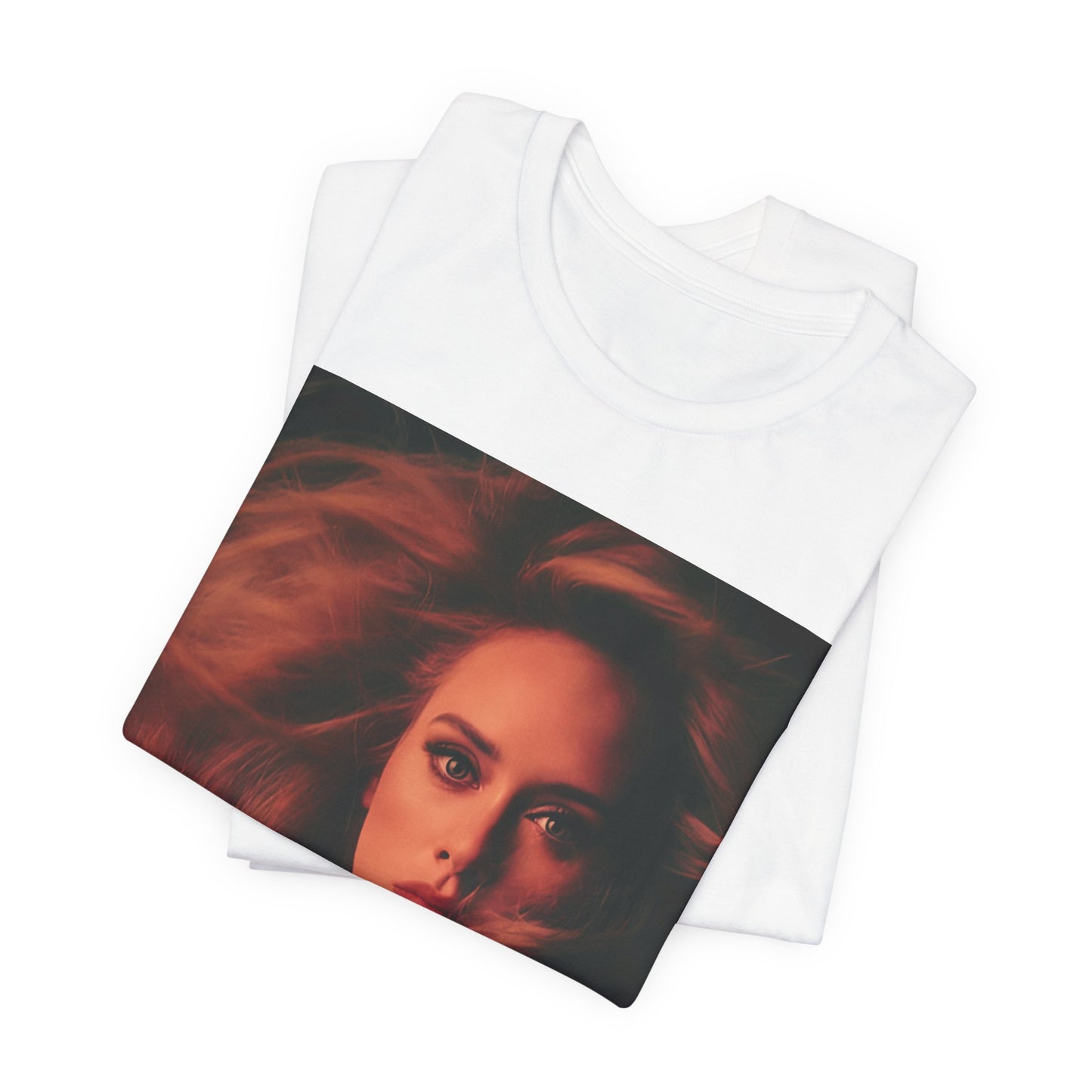 A black graphic t-shirt featuring a glamorous portrait of Adele wearing a golden gown, with voluminous hair, bathed in warm lighting, giving an editorial look.