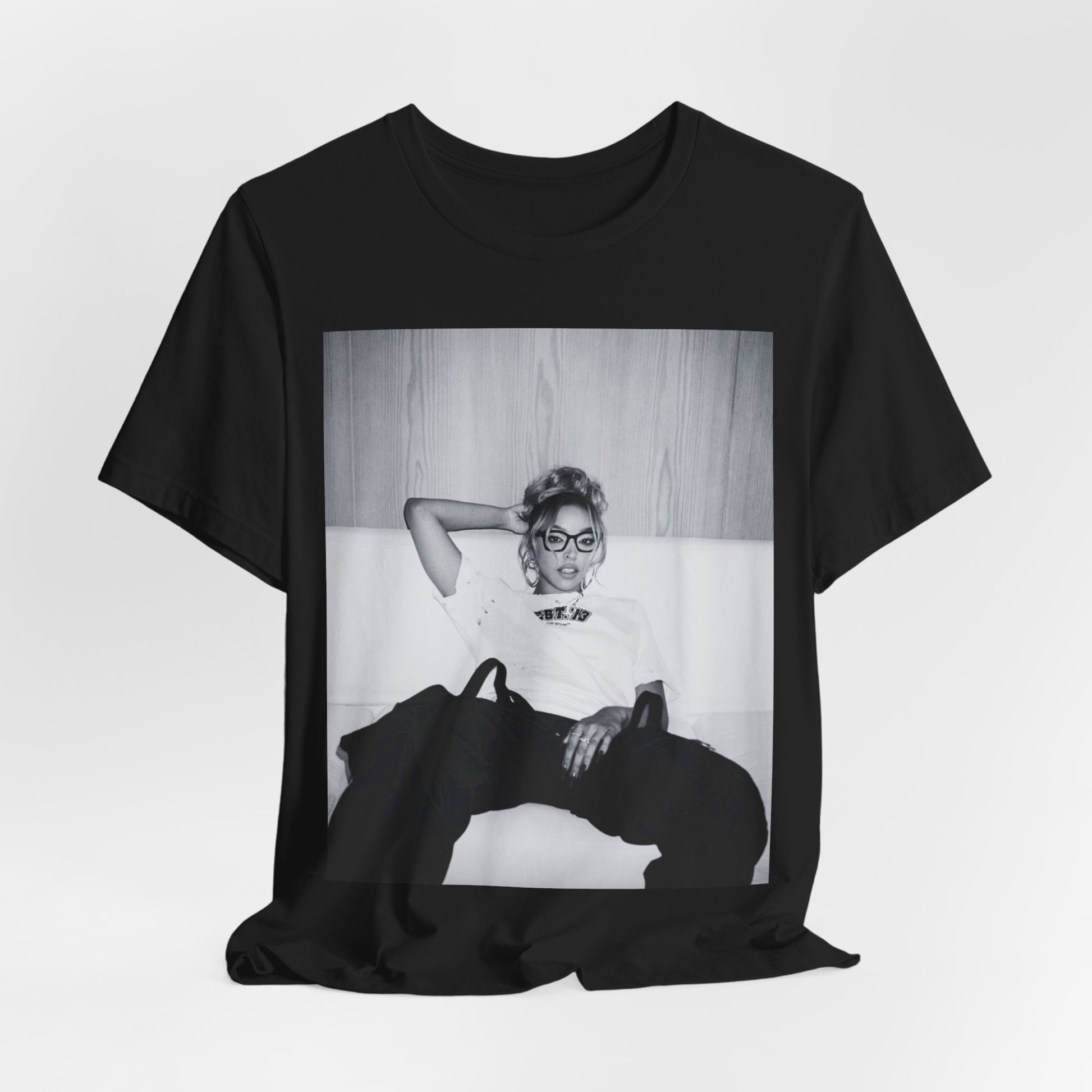 A black graphic t-shirt featuring a black and white portrait photo of Tinashe.
